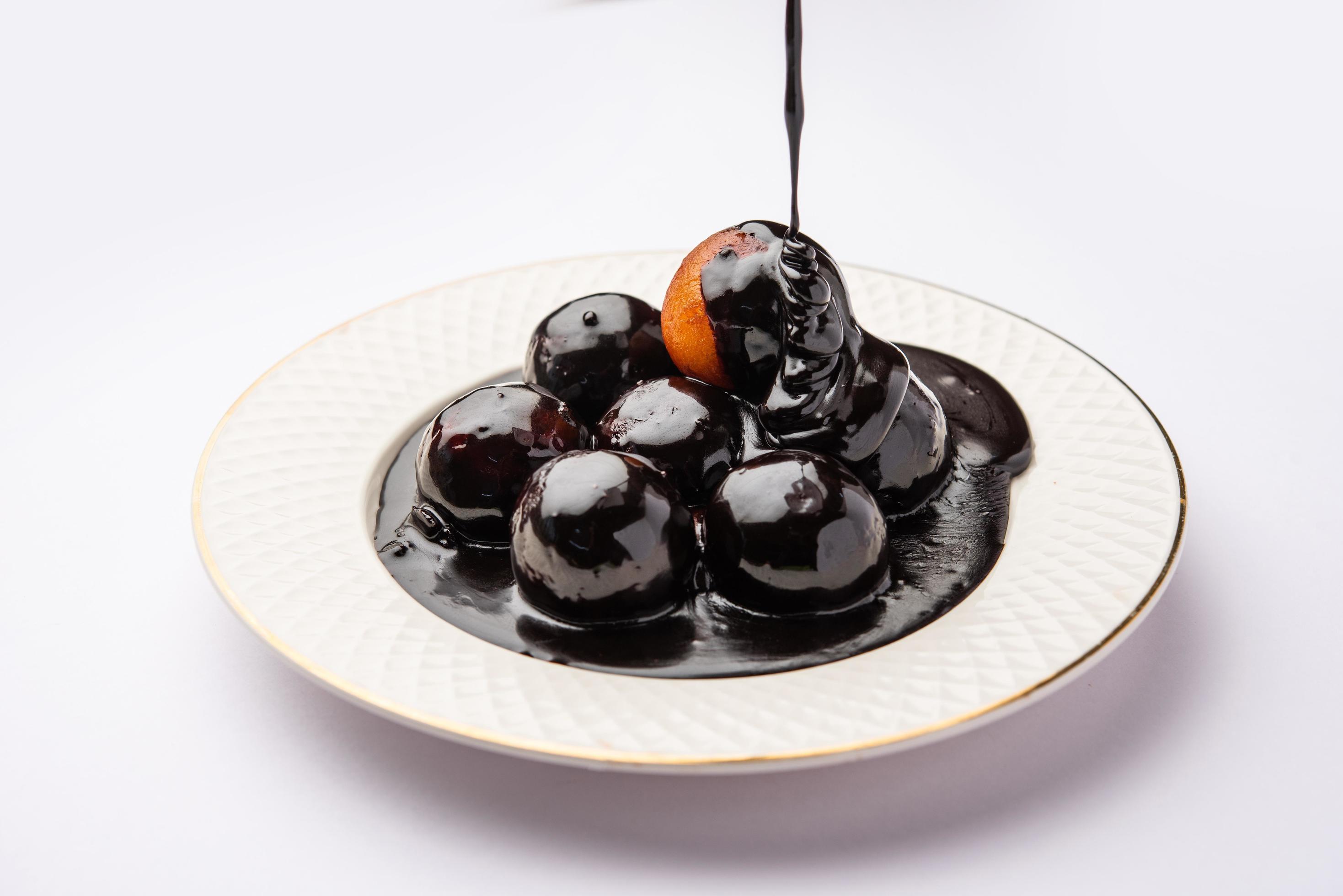 Chocolate dipped gulab jamun, indian creative fusion dessert food Stock Free