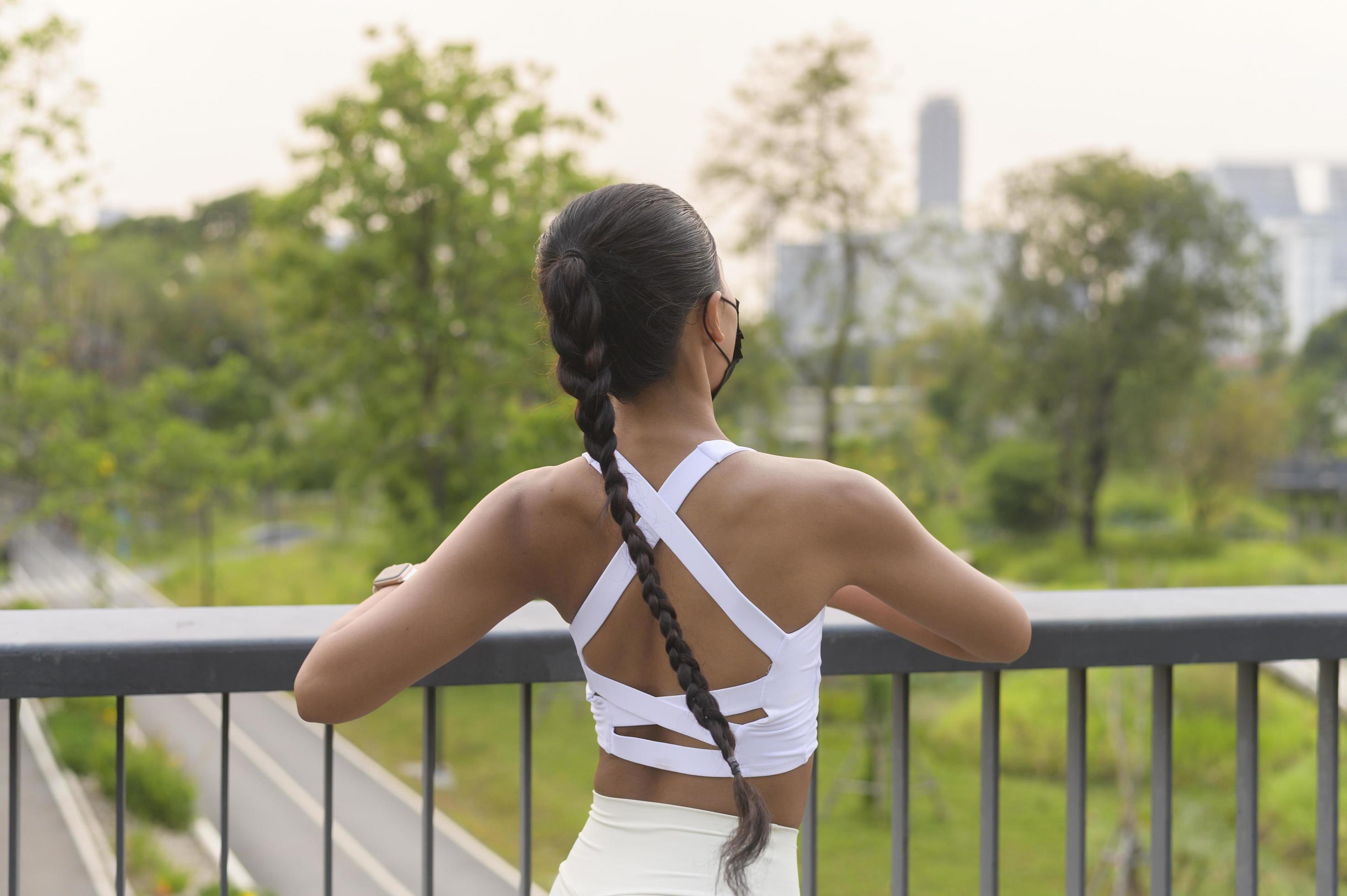 Young fitness woman in sportswear wearing face mask while exercise in city park, Health and Lifestyles. Stock Free