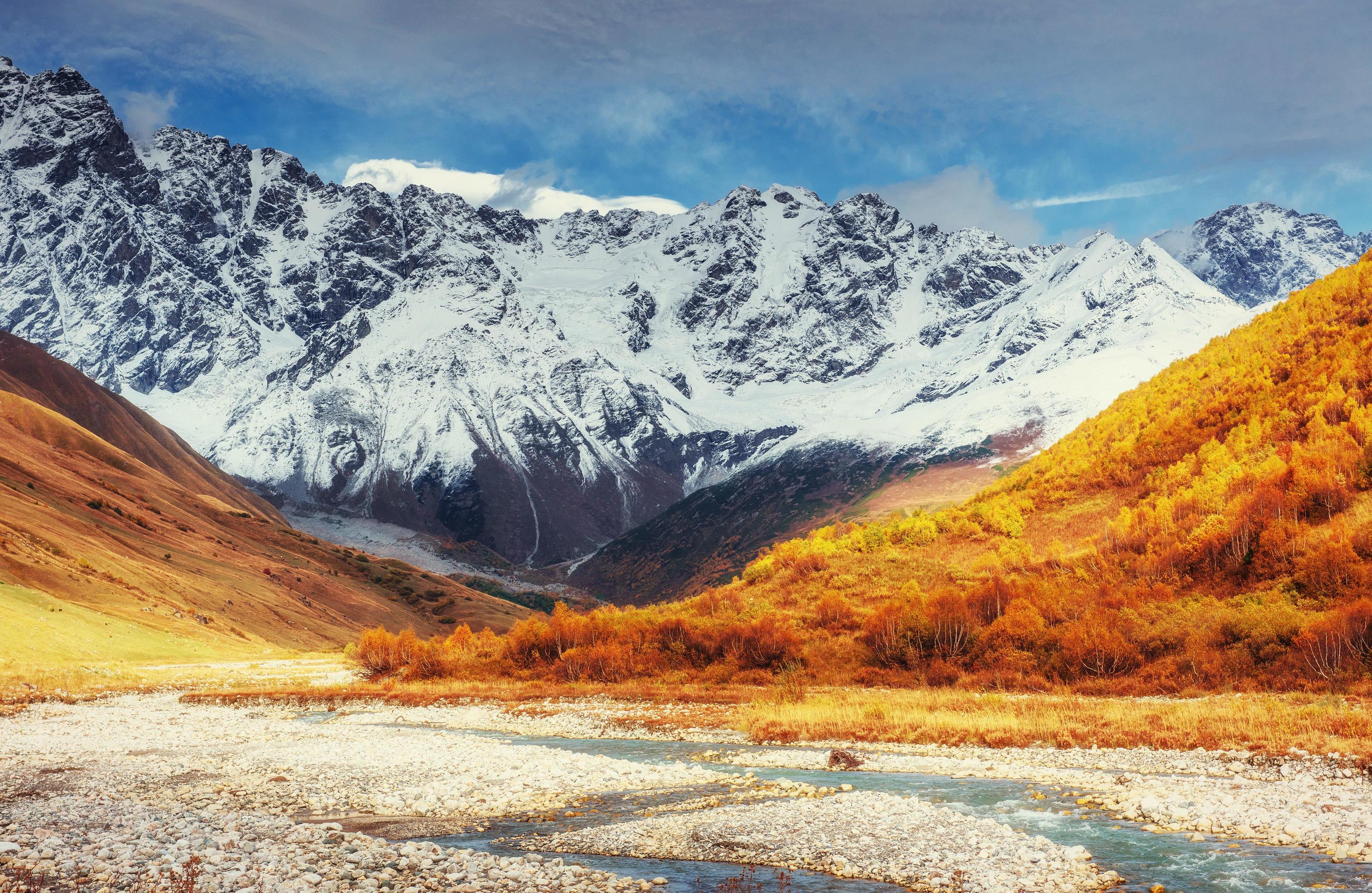 Snowy mountains and noisy mountain river. Georgia, Svaneti. Euro Stock Free