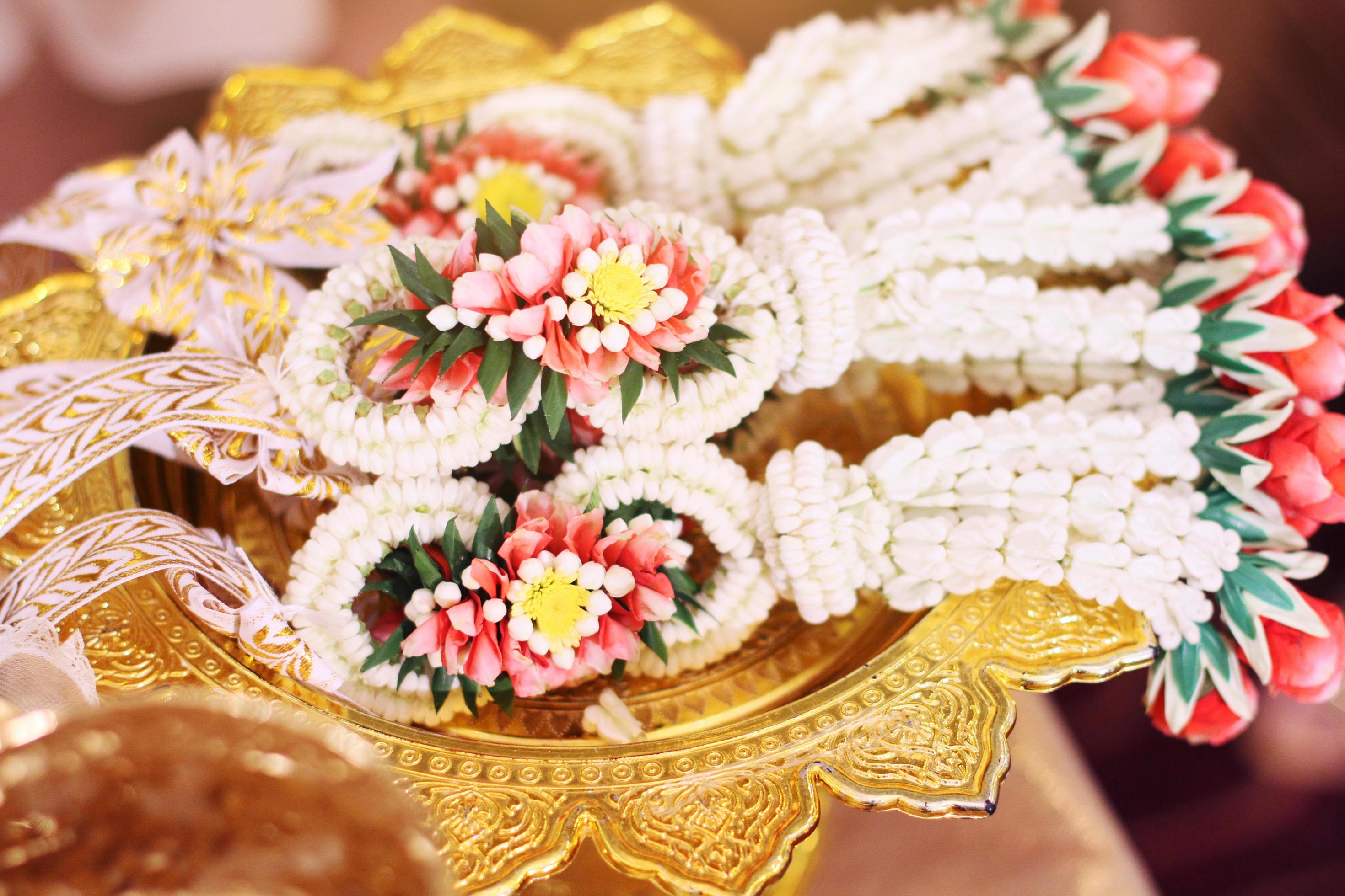 Flower garlands on a gold tray in tradition Thai wedding ceremony day. Jasmine garland Stock Free