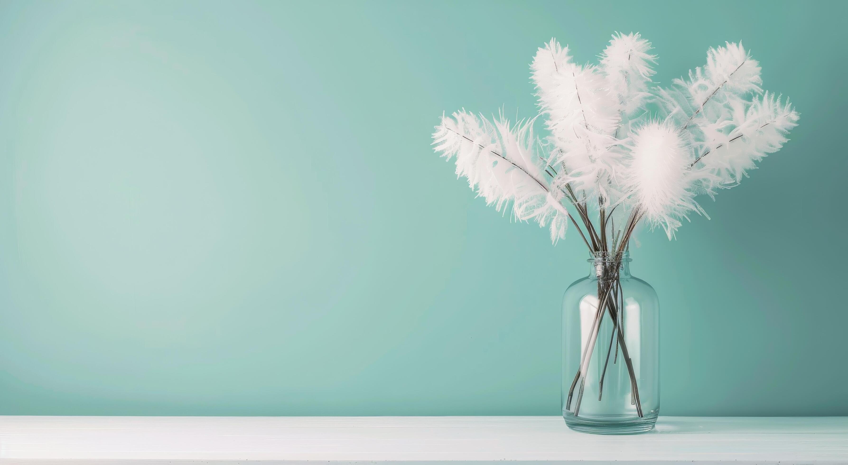 Elegant White Flowers in a Simple Vase Against a Soft Blue Background Stock Free