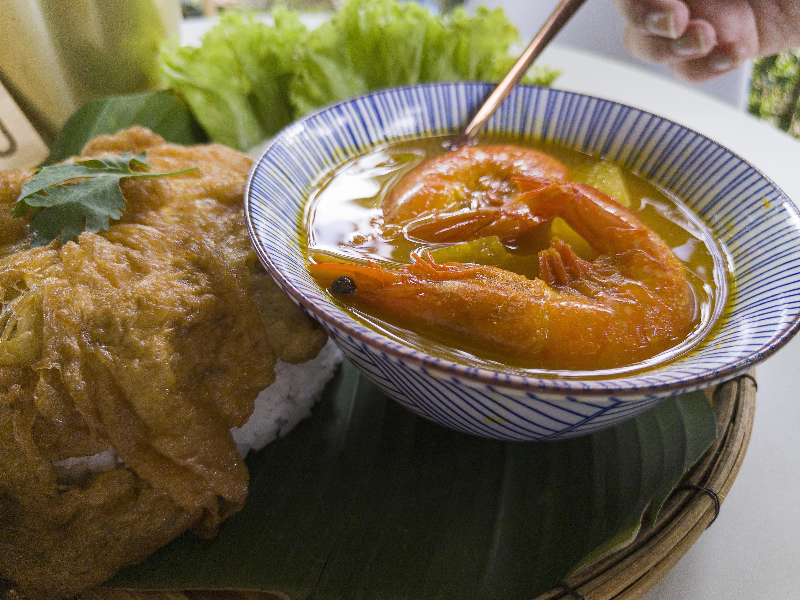 Close up Hot and spicy soup with papaya and Shrimp in bowl.Thai traditional healthy menu and diet food. Selected focus Stock Free