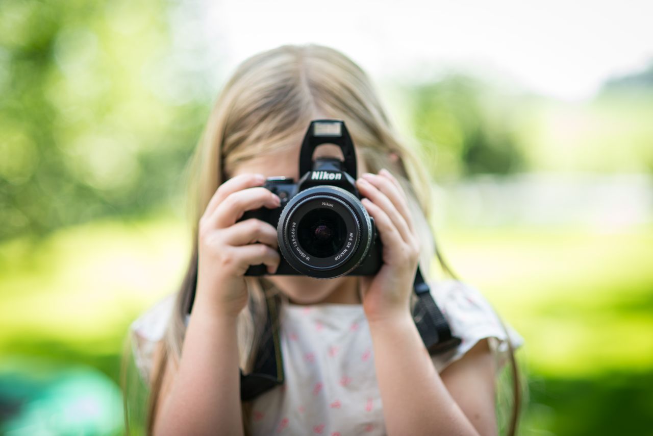 Girl taking a picture Stock Free