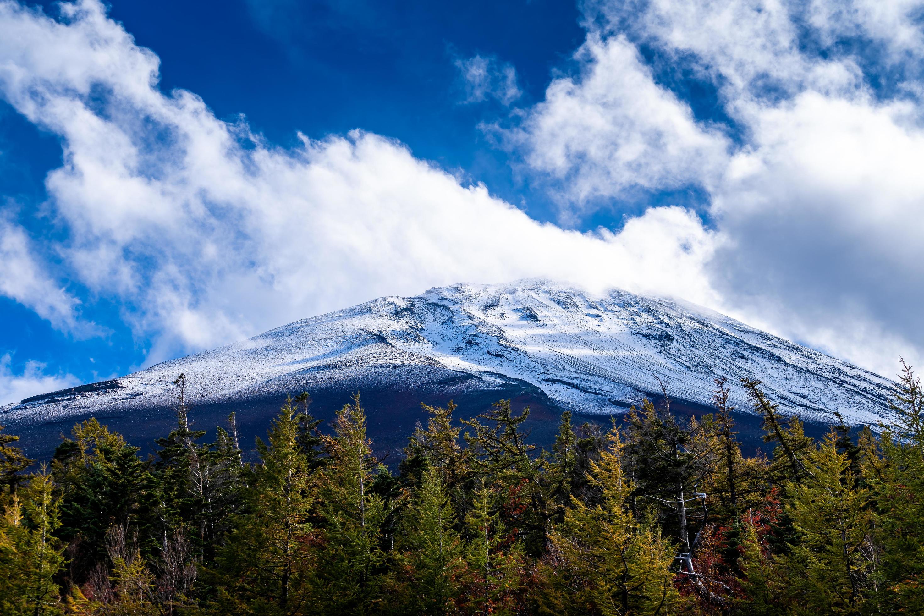 Close up top of Fuji mountain with snow cover and wind on the top with could in Japan. Stock Free