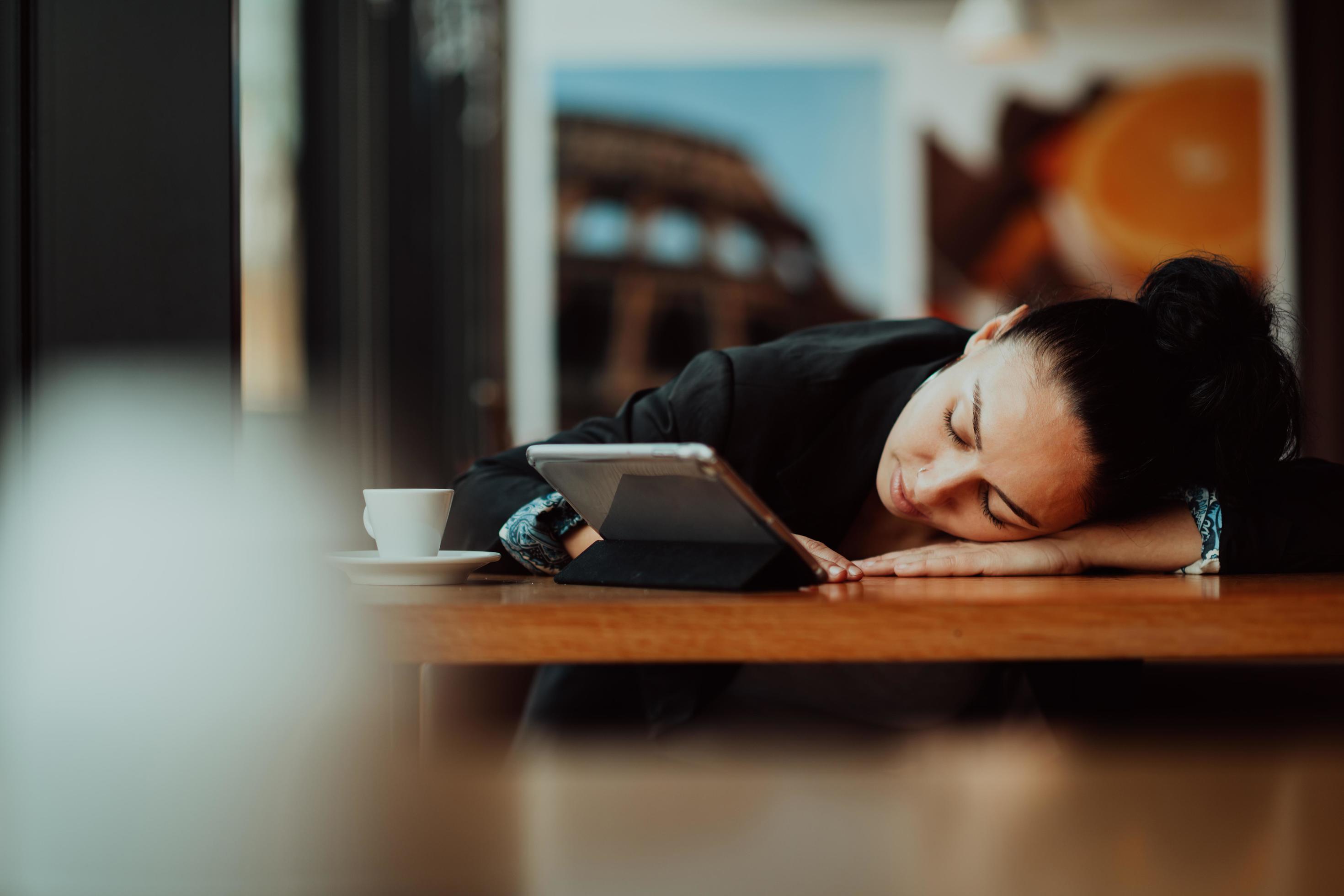 Lifestyle freelance woman he has resting sleeping after hard work long time in coffee shop Stock Free