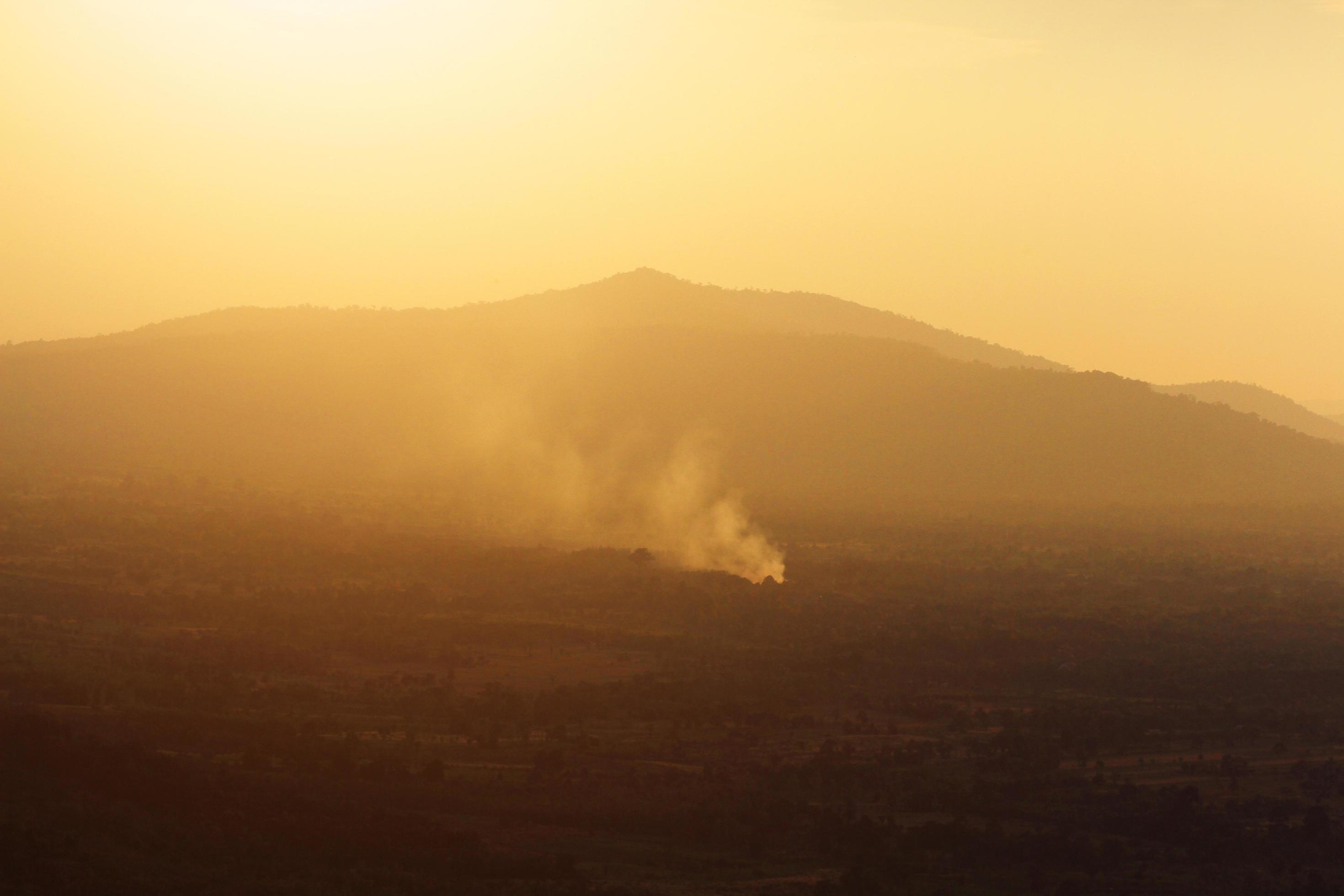 Beautiful landscape layers of mountain and Misty on hill valley in golden twilight of sunset at Thailand Stock Free