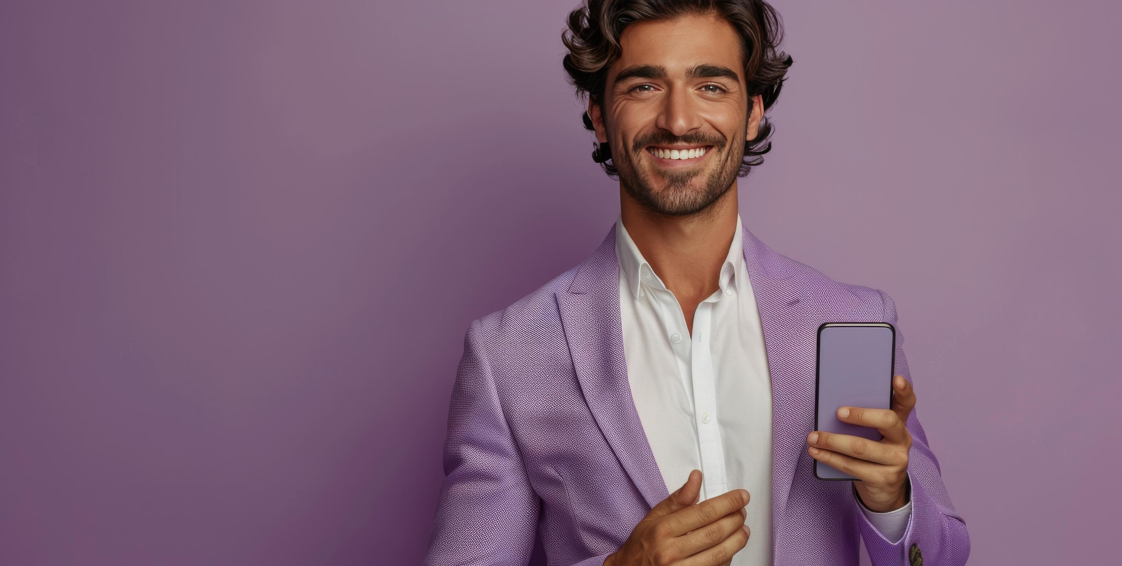 Smiling Man Holding Smartphone Against Purple Background Stock Free