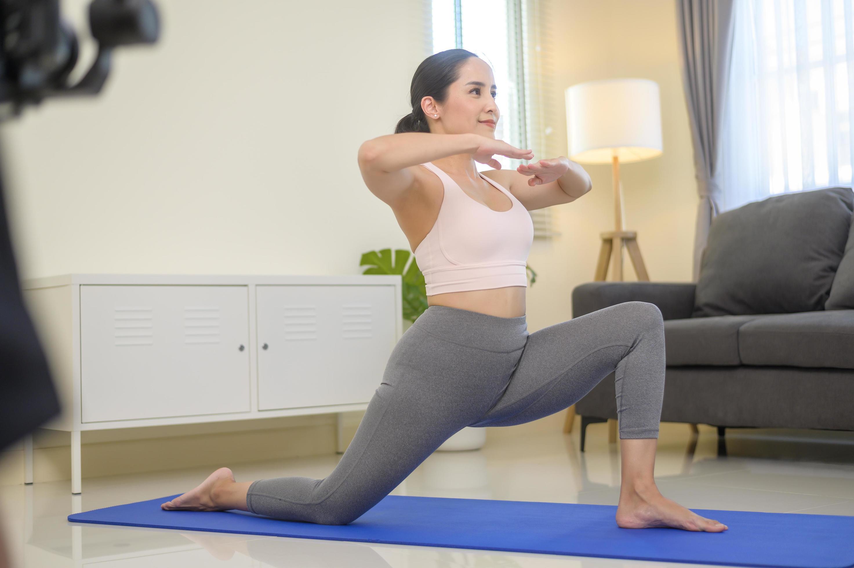 Behind the scenes of Fit young woman doing yoga and meditation at home, sport and healthy lifestyle concept. Stock Free