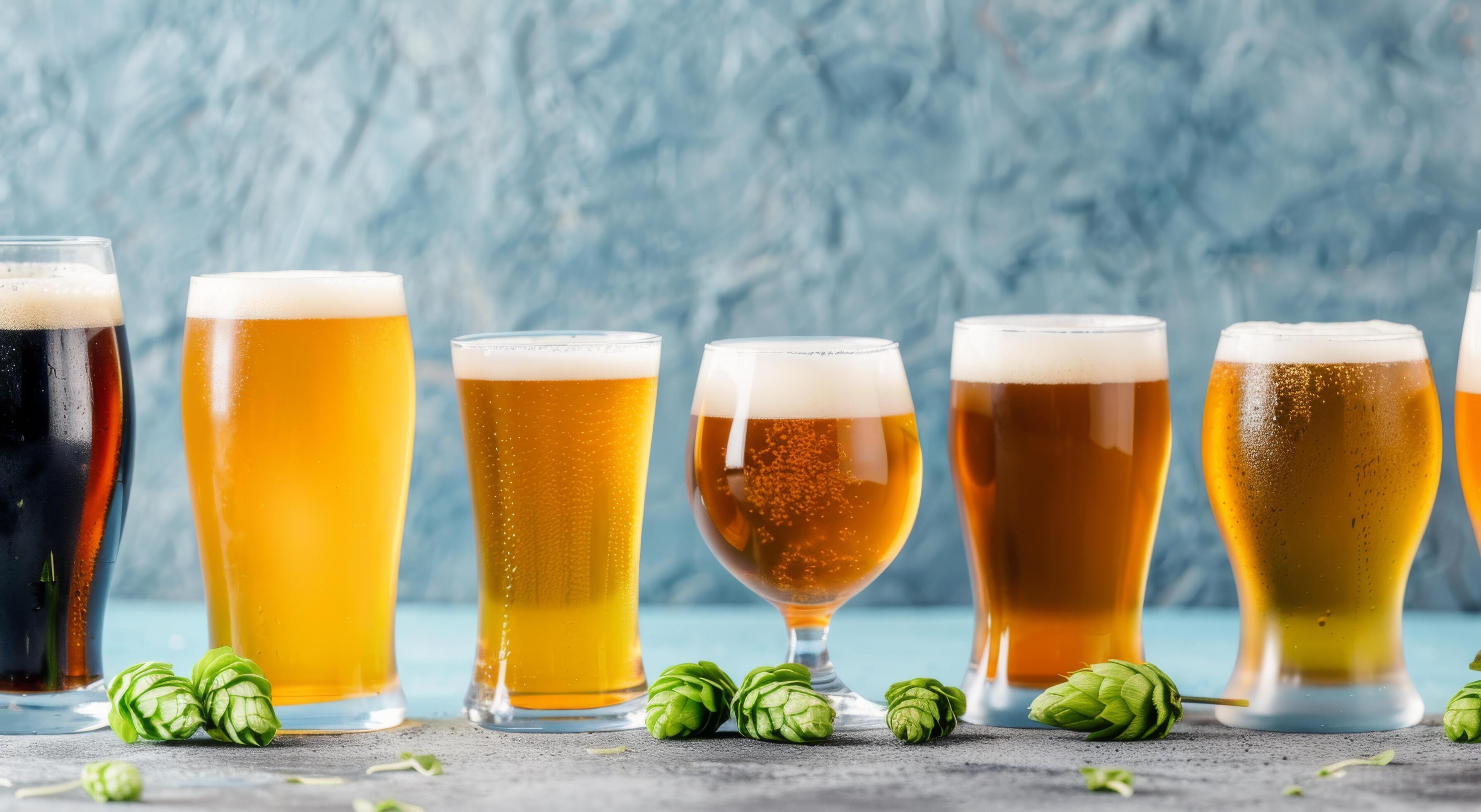 Variety of Craft Beers With Hops on Table Background Stock Free