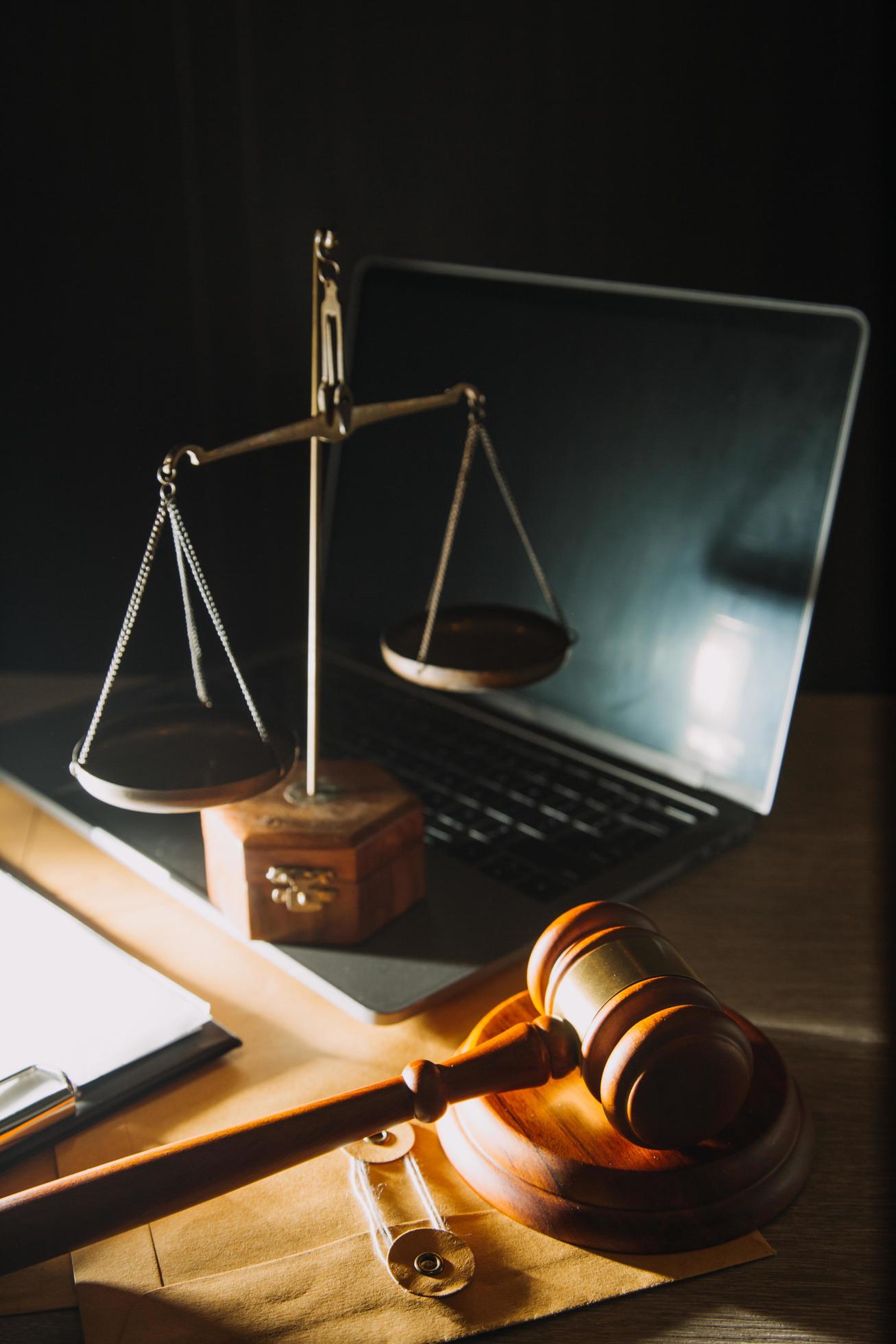 Business and lawyers discussing contract papers with brass scale on desk in office. Law, legal services, advice, justice and law concept Stock Free