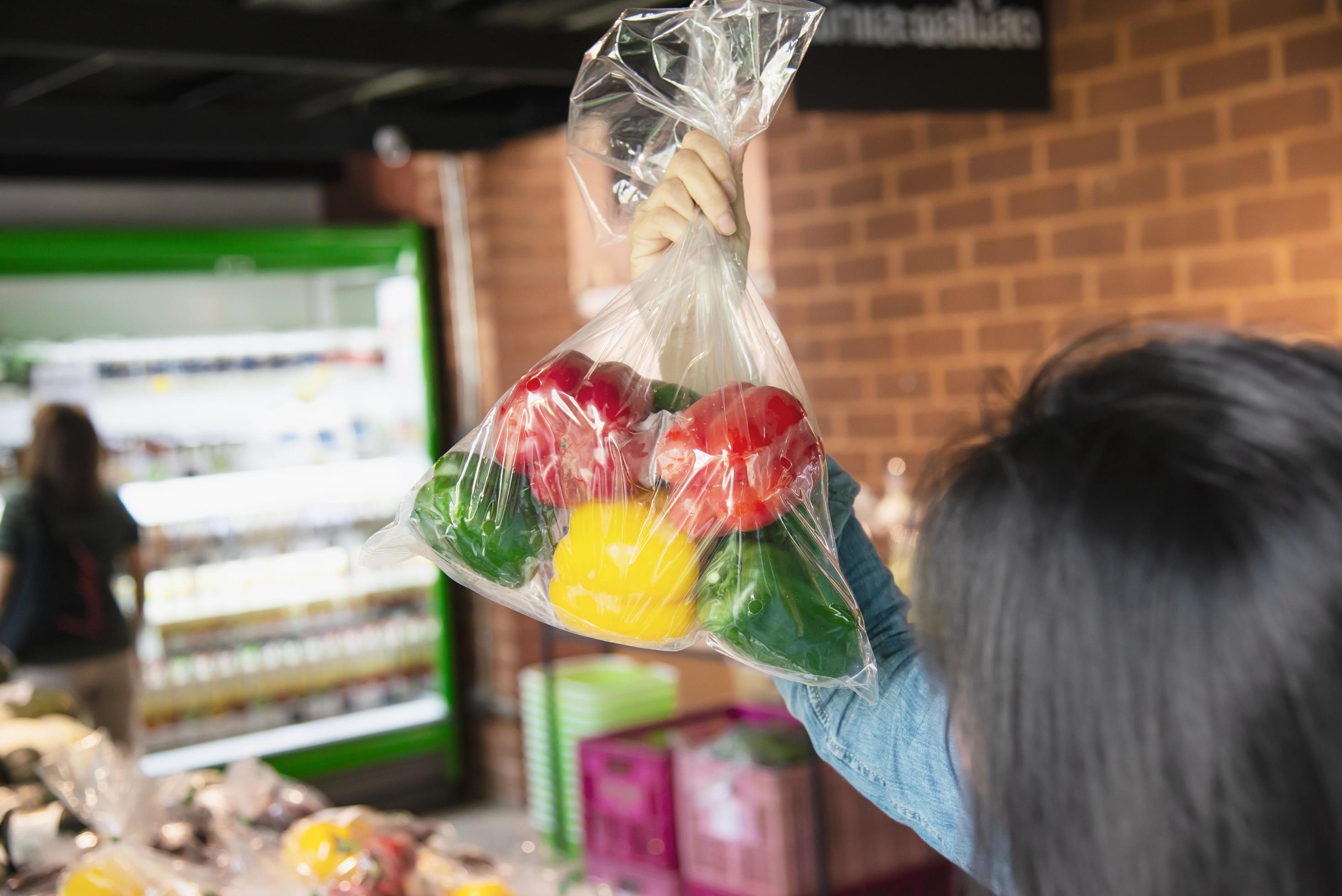 Lady is shopping fresh vegetable in supermarket store – woman in fresh market lifestyle concept Stock Free