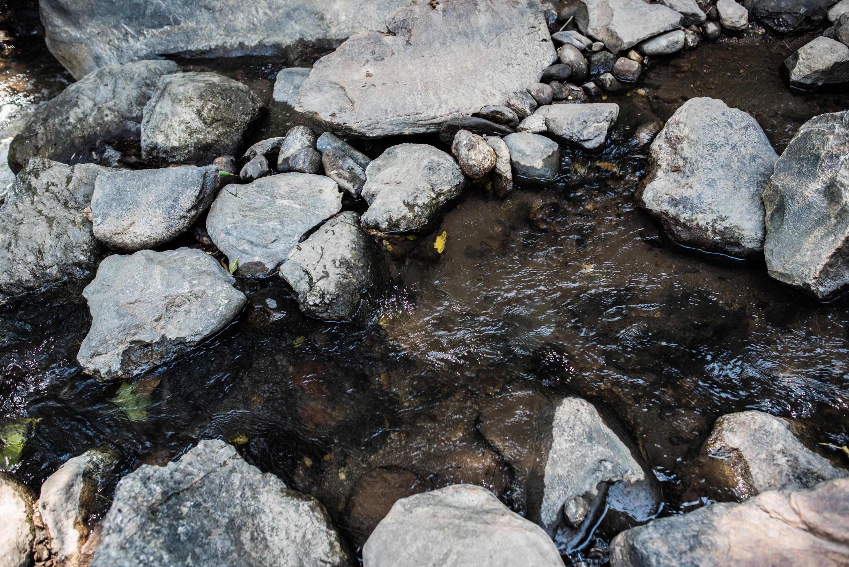 Waterfall in the nature and stone background Stock Free