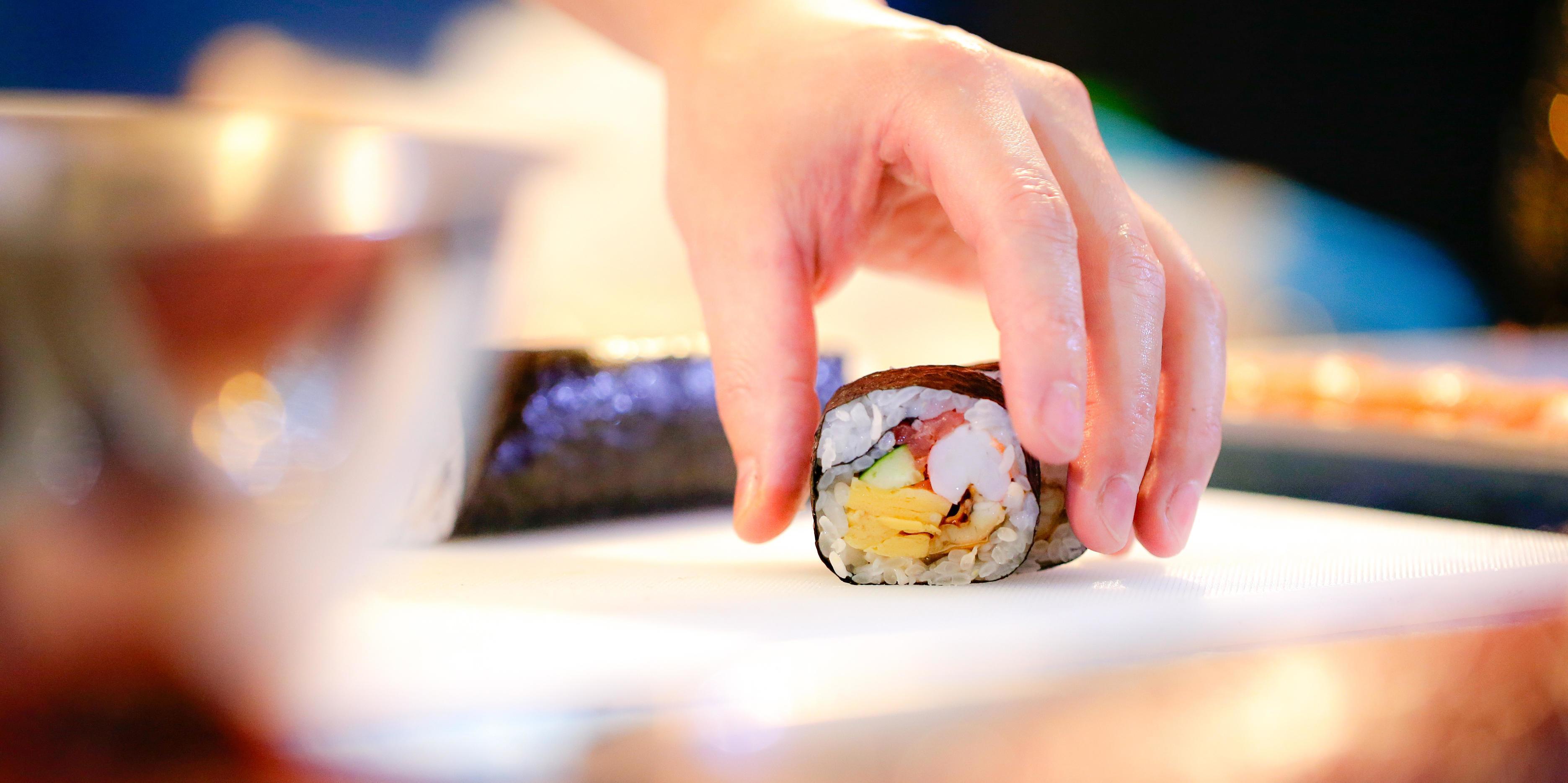 chef hands preparing japanese food, chef making sushi Stock Free