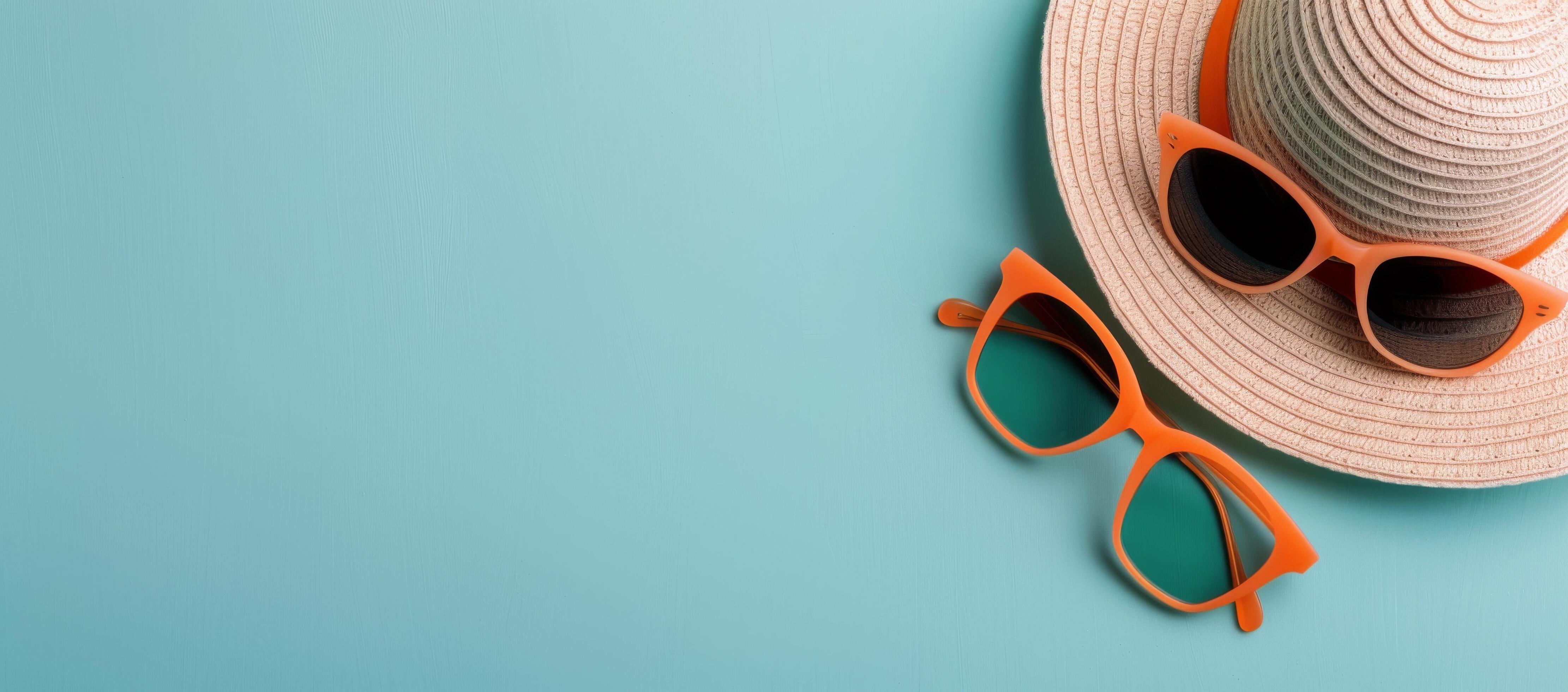 Summer Accessories With Orange Sunglasses And Straw Hat On Turquoise Background Stock Free