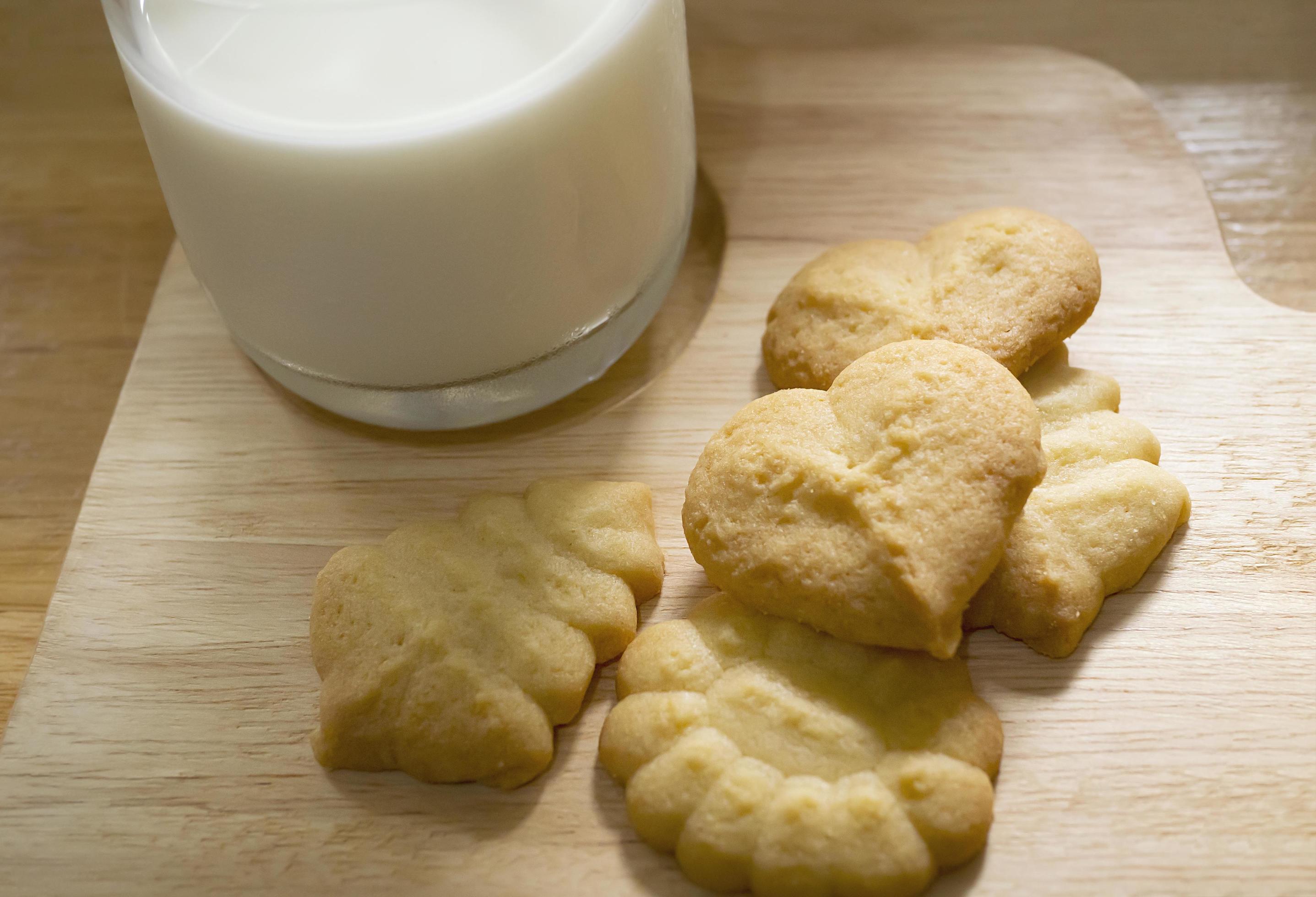 butter cookies with milk ready for serve, crispy chip snack dairy freshness bakery photography for food sweet dessert background use Stock Free