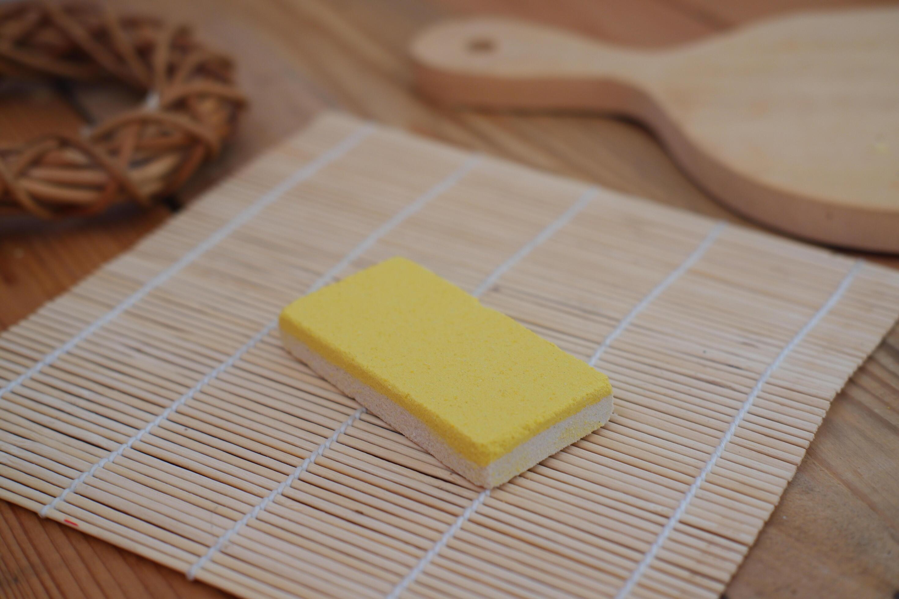 yellow snacks on a bamboo mat, close-up, selective focus Stock Free