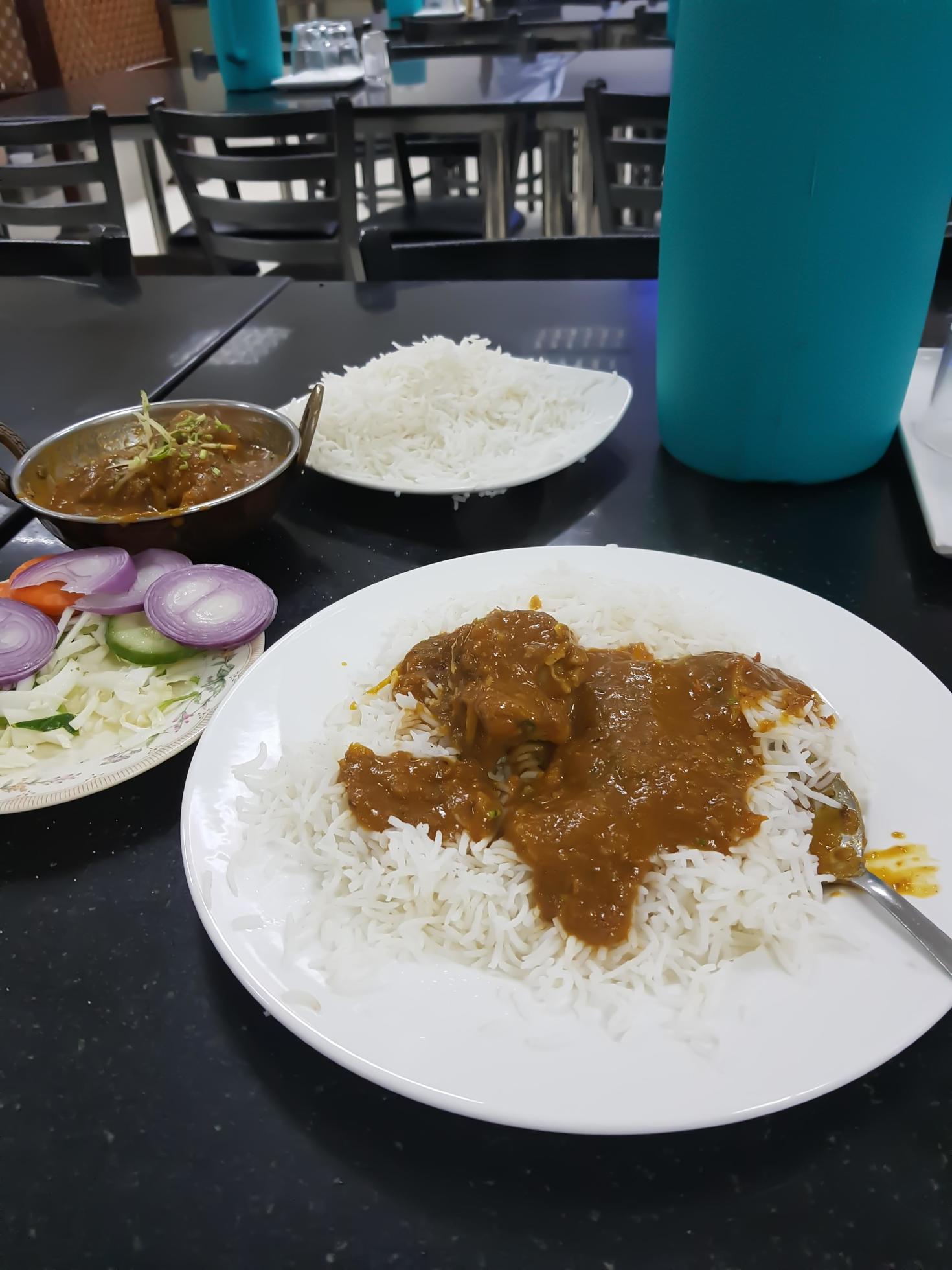 Mutton satay is traditional food in India. grilled with soy sauce and peanut sauce. with rice on the side. with tomatoes and onions topping. Stock Free