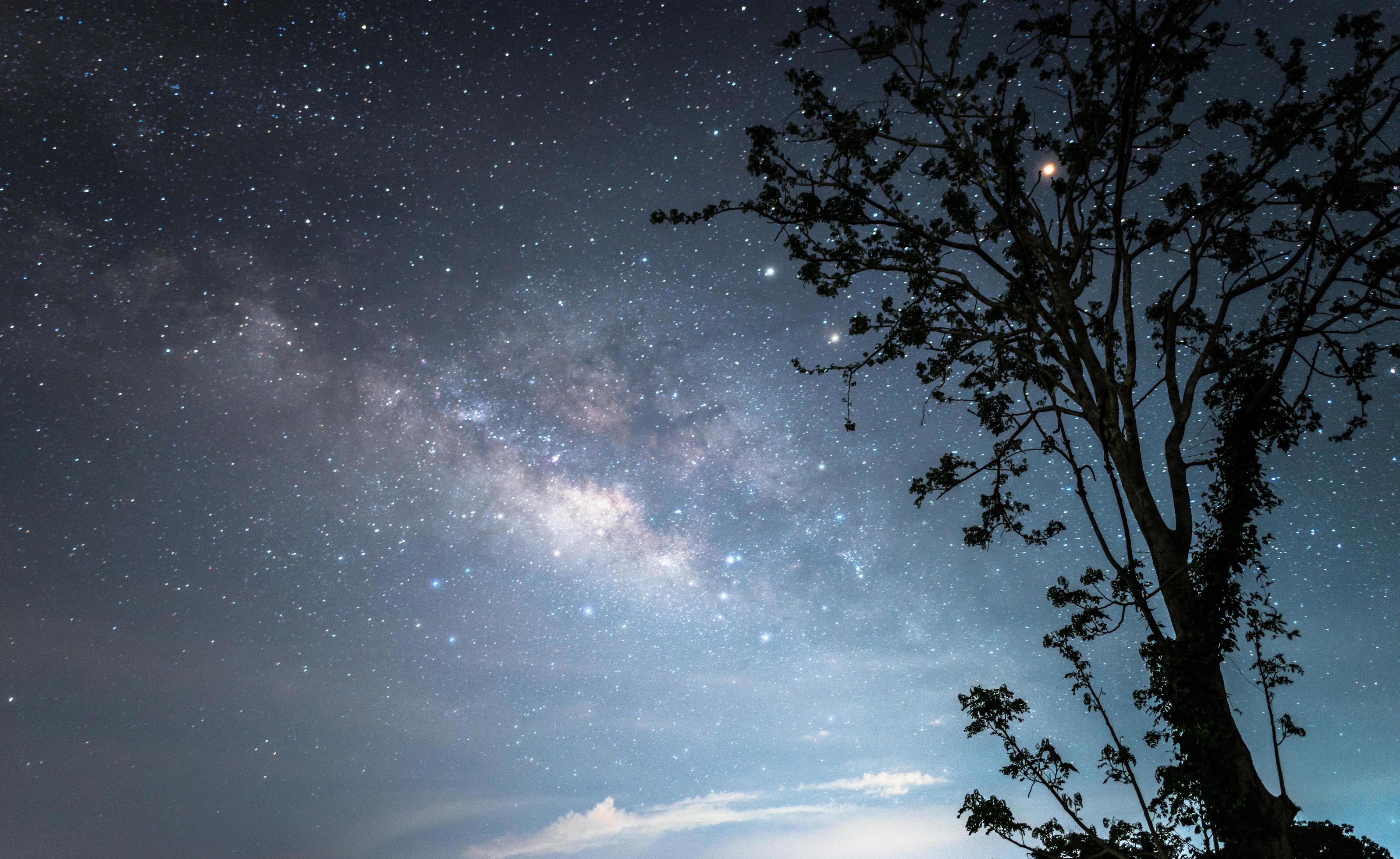 The Milky way galaxy over the starry night sky. Stock Free