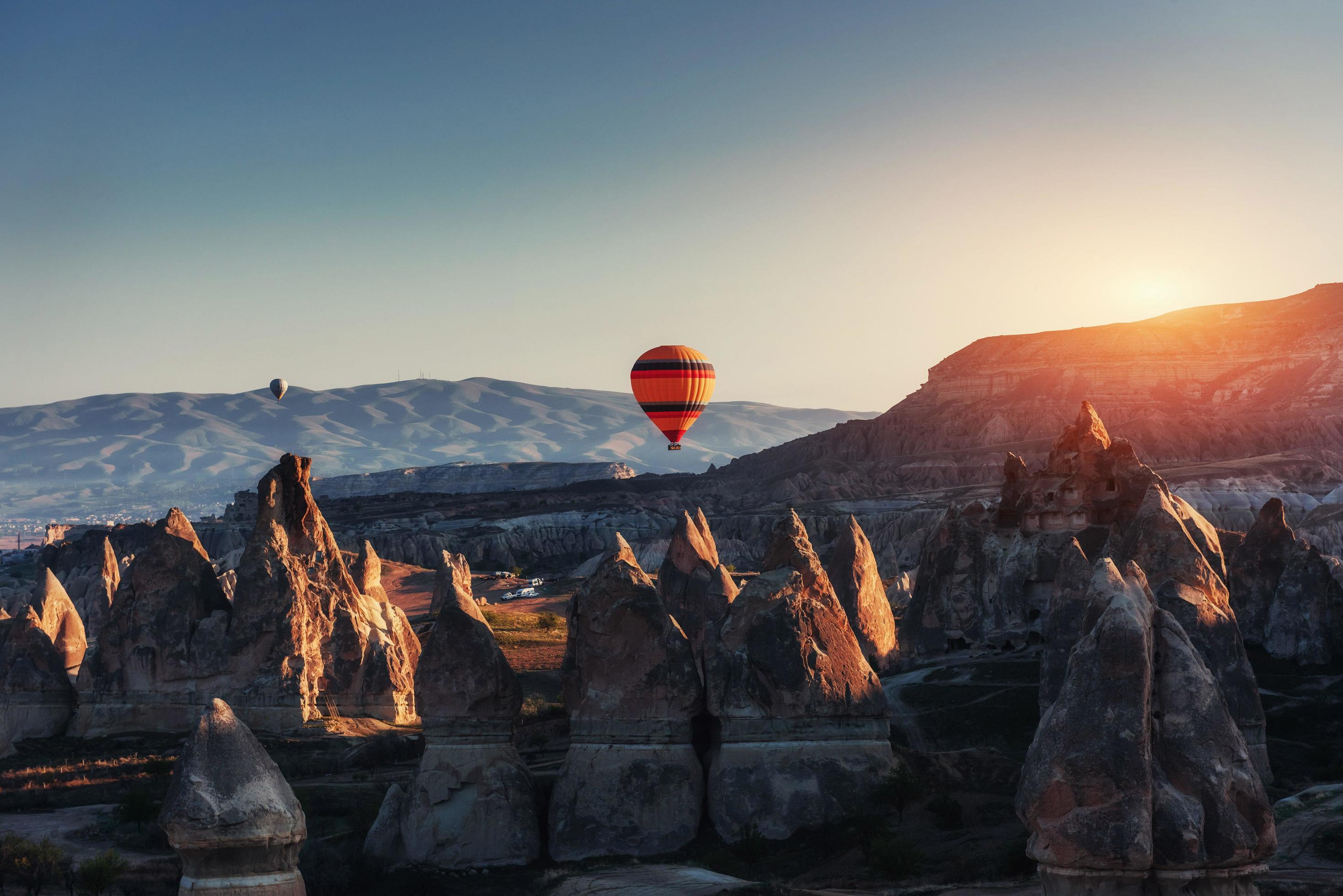 Amazing sunset over Cappadocia. Beautiful color balloons. Turkey Stock Free