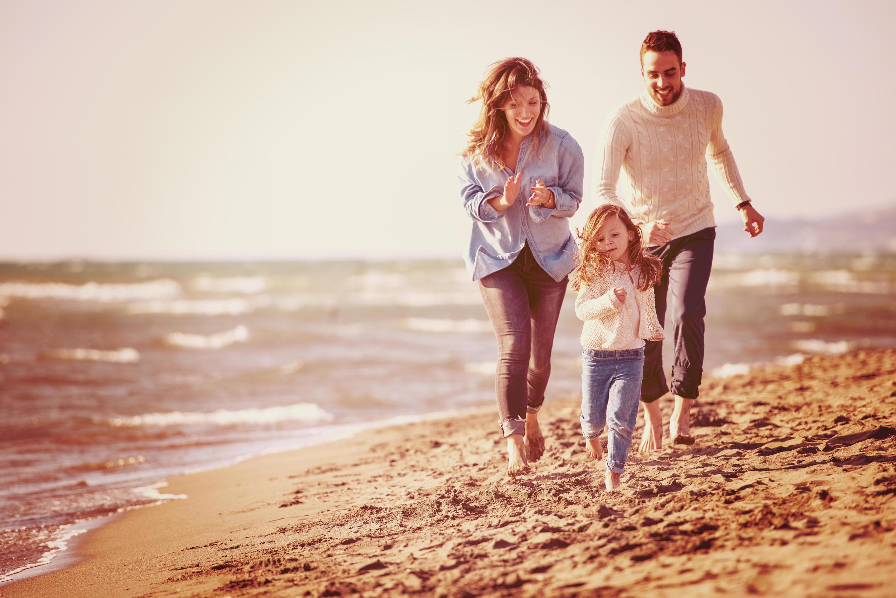 Young family enjoying vecation during autumn Stock Free