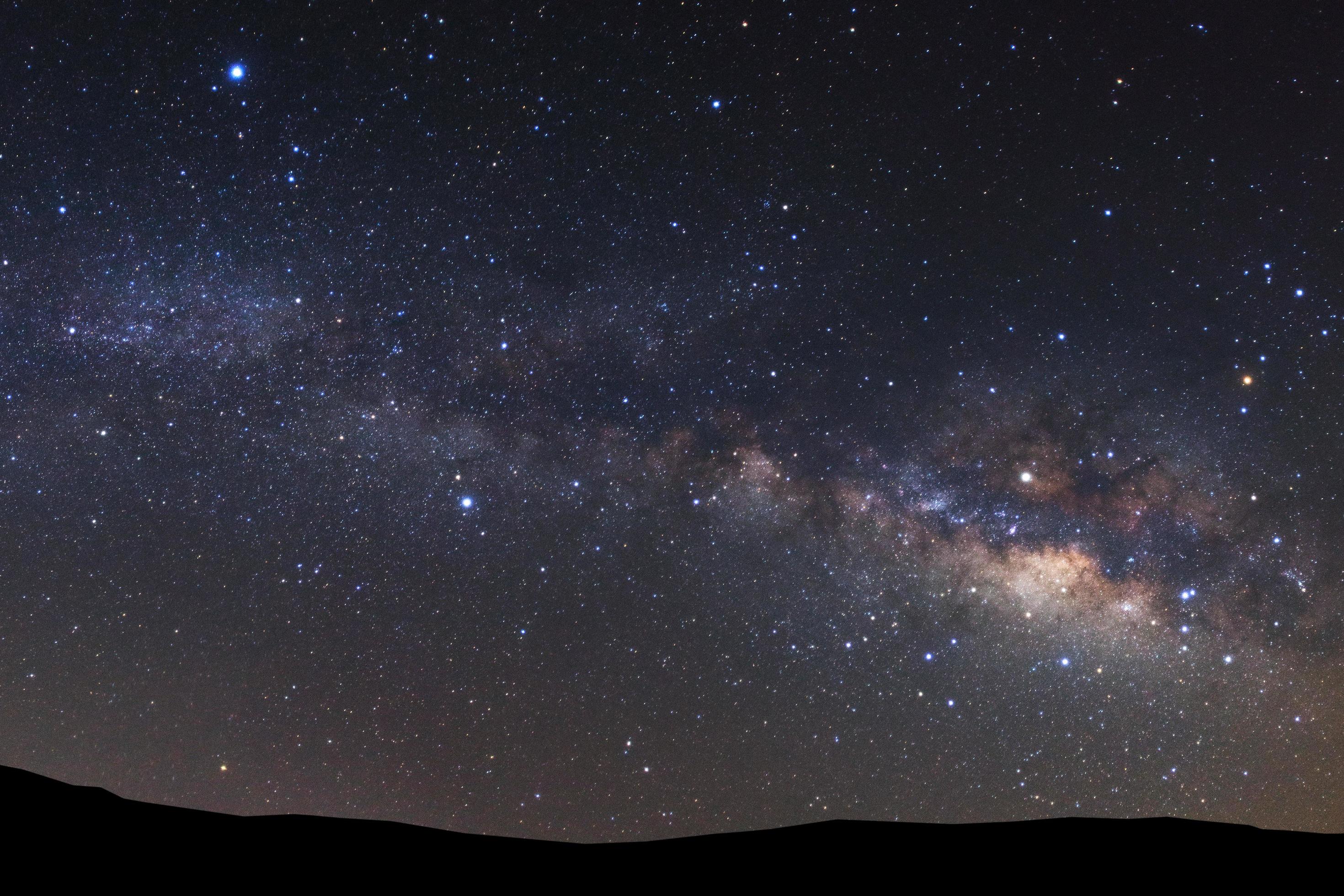 landscape with milky way, Night sky with stars and silhouette high mountain. Stock Free