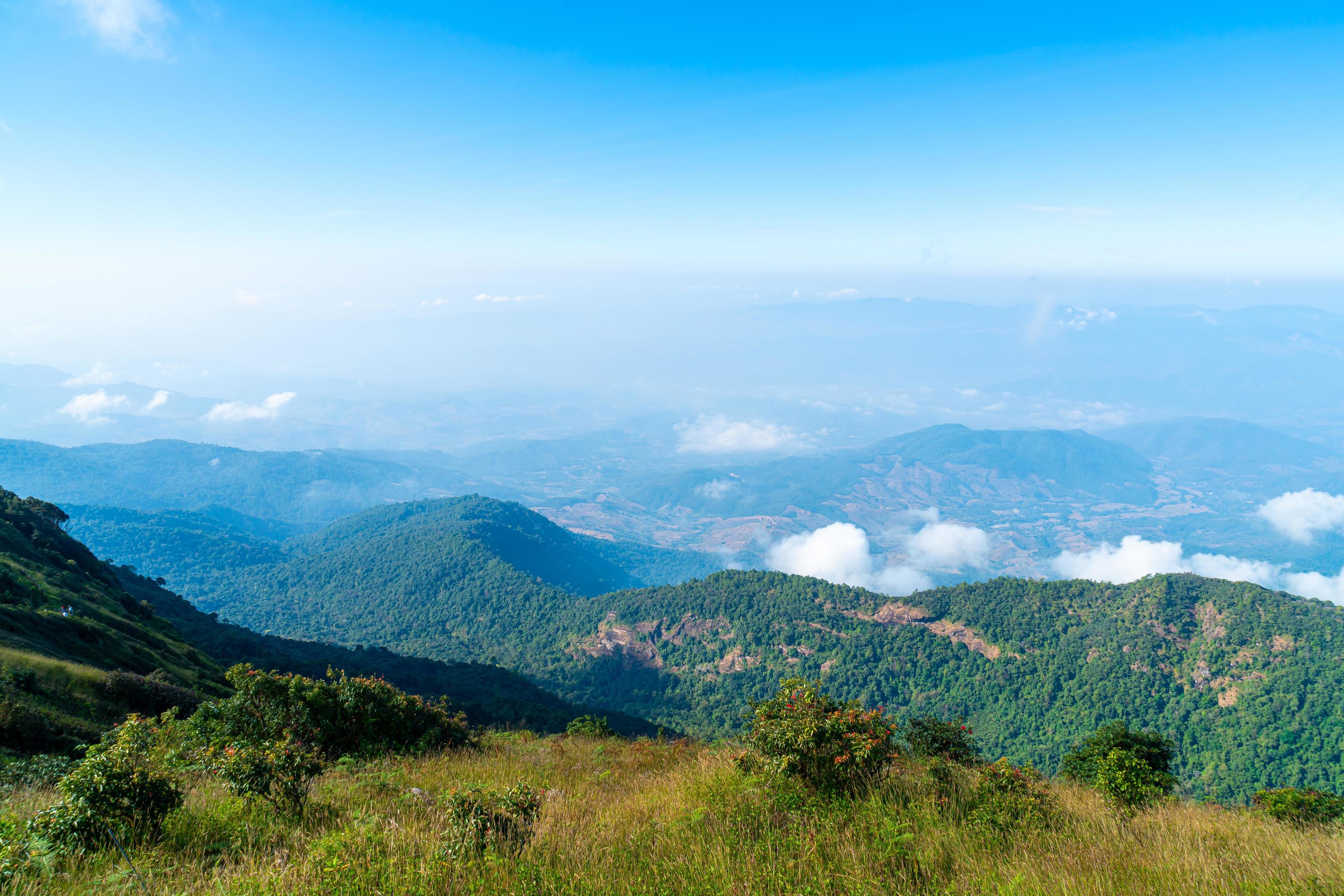 Beautiful mountain layer with clouds and blue sky at Kew Mae Pan Nature Trail in Chiang Mai, Thailand Stock Free