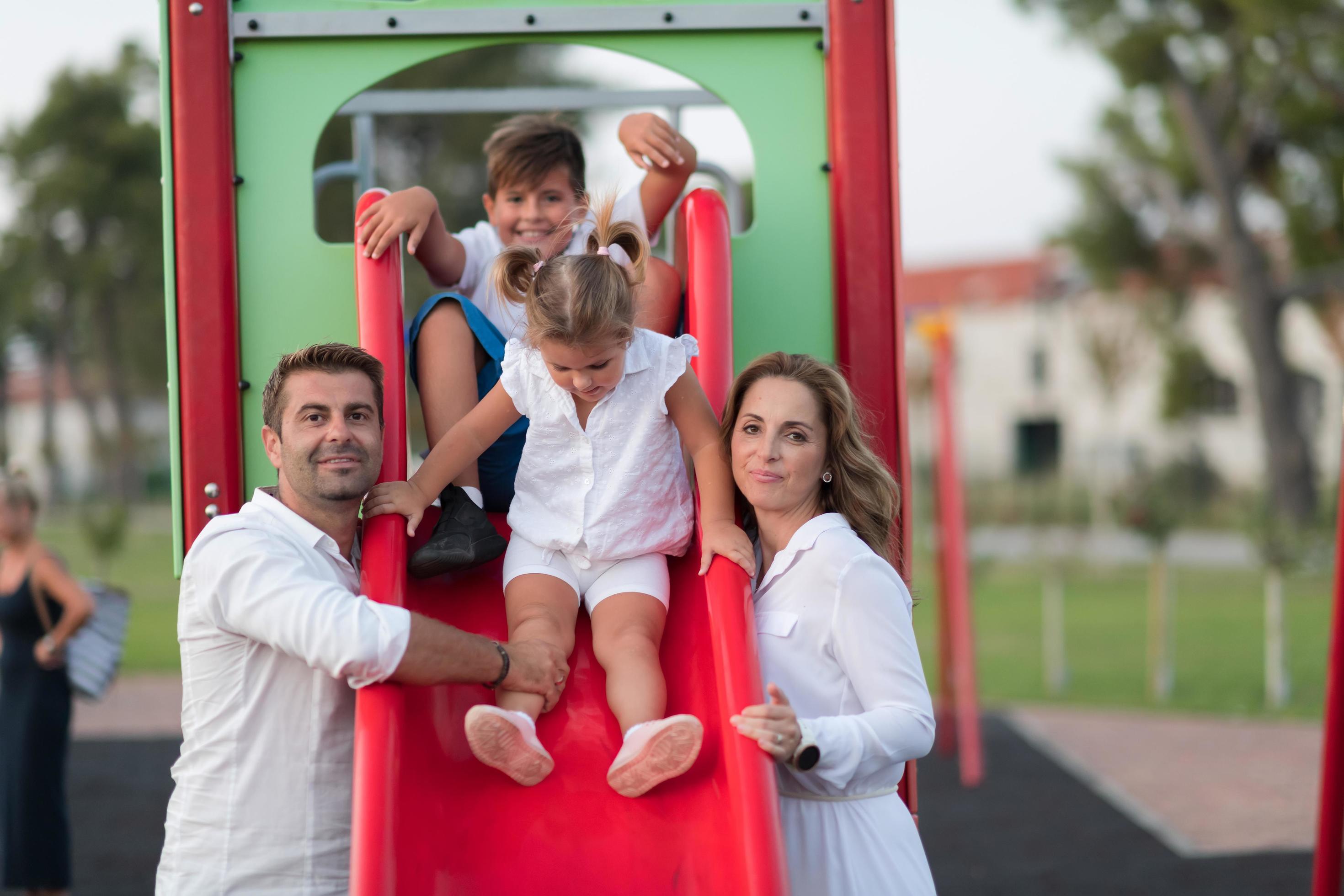 Senior couple in casual clothes with their children spending time in park a vacation together. Family time . Selective focus Stock Free