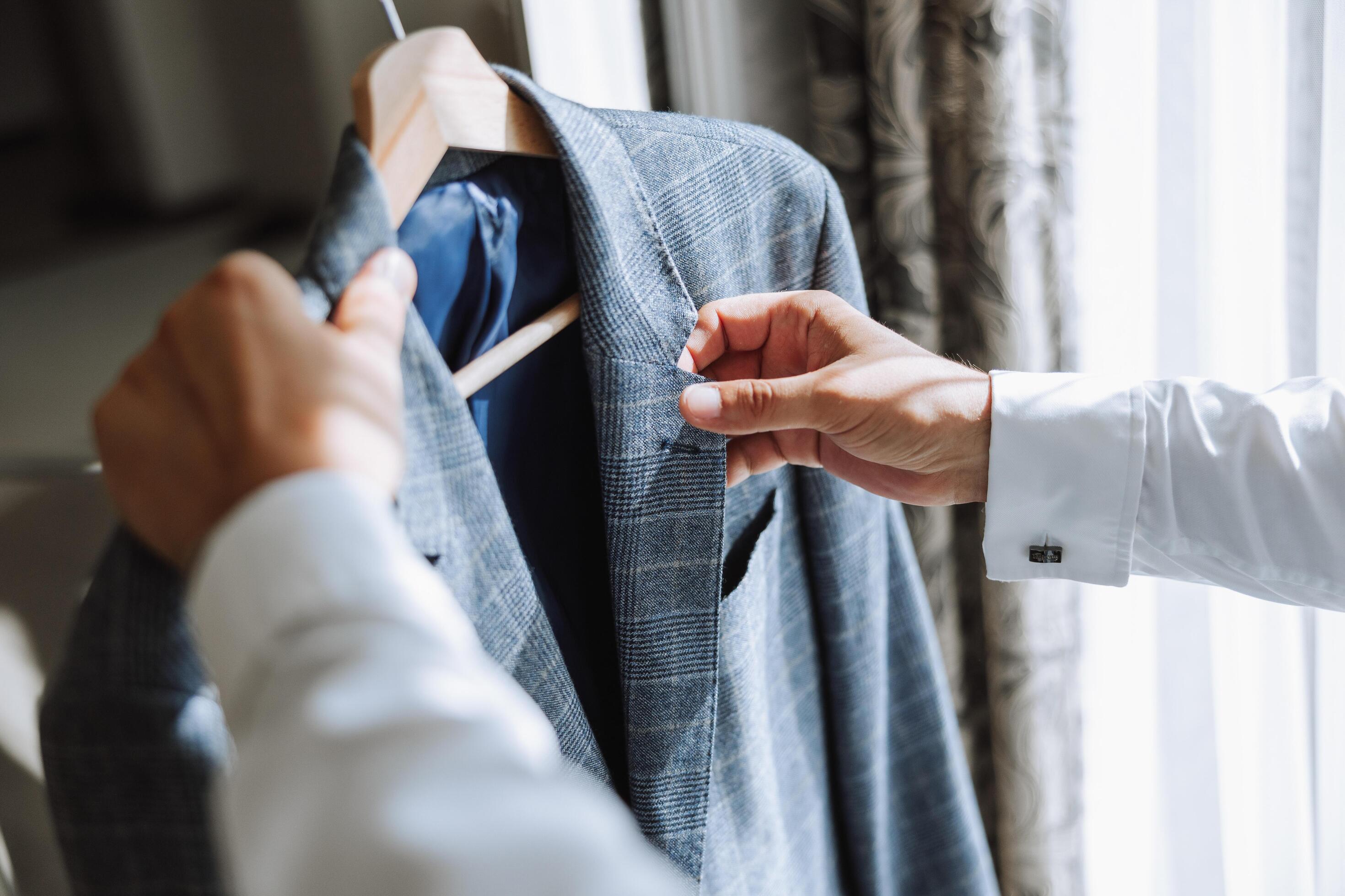 blue men’s suit. The man is ready to wear a business suit, white shirt and tie. A blue jacket on a mannequin Stock Free