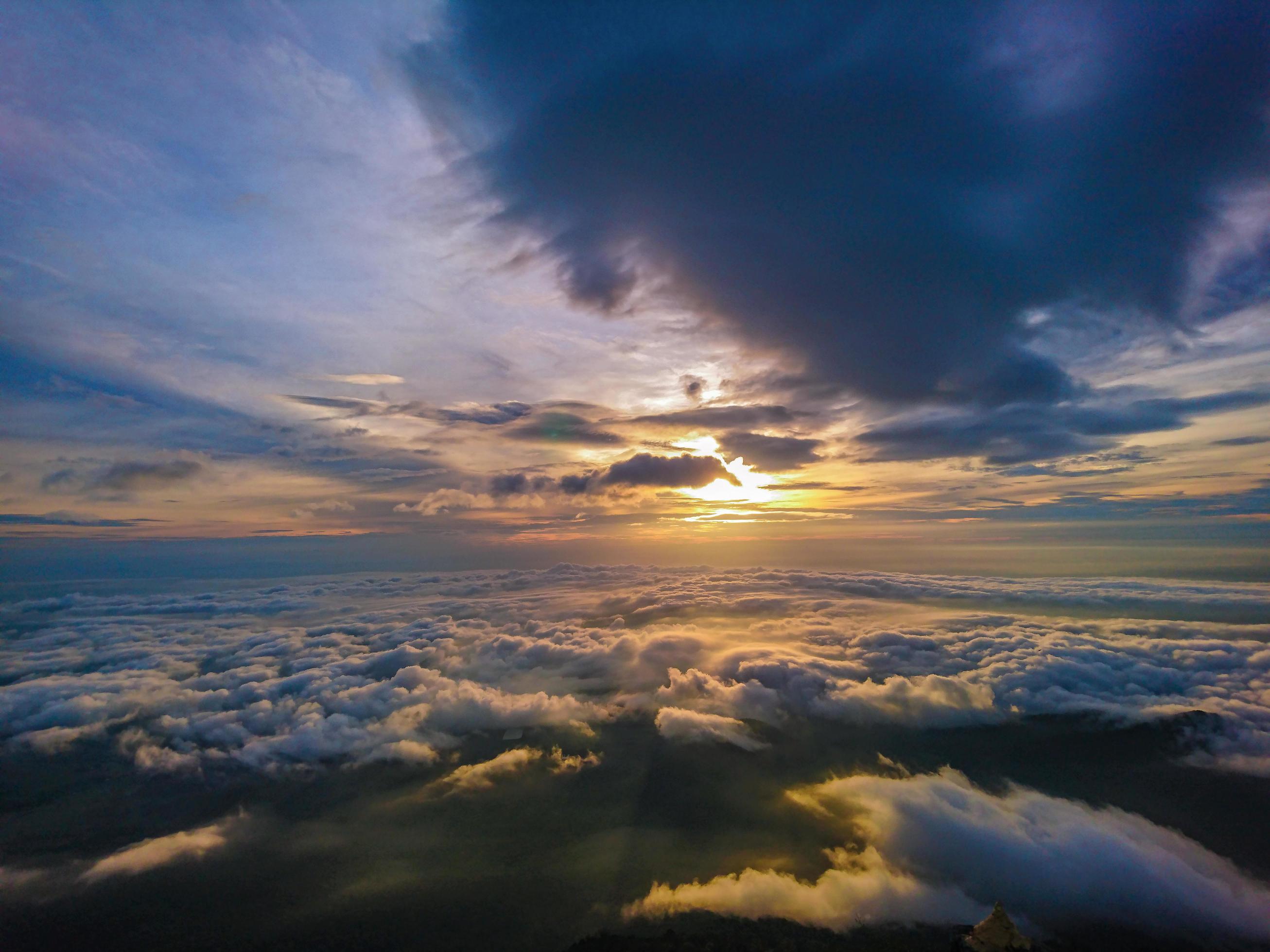 Beautiful Sunrise Sky with Sea of the mist of fog in the morning on Khao Luang mountain in Ramkhamhaeng National Park,Sukhothai province Thailand Stock Free