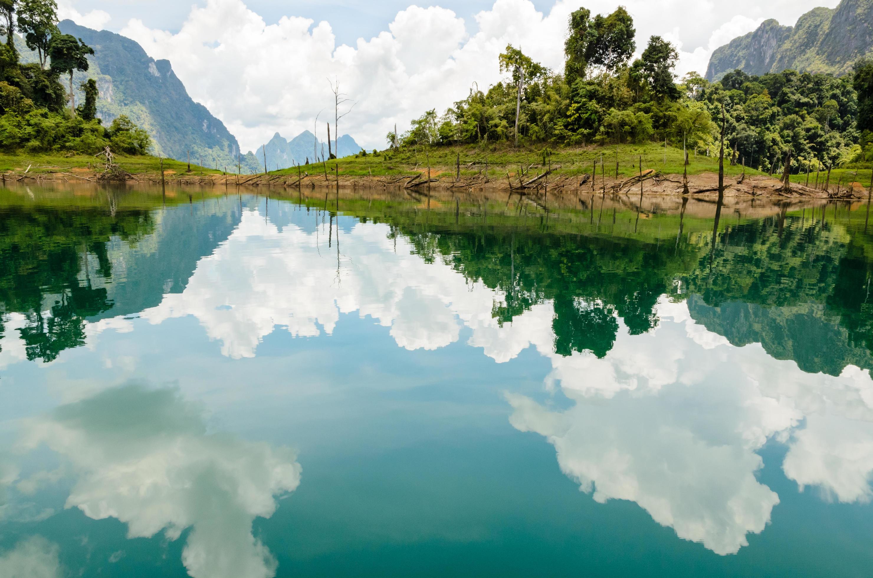 Water surface reflecting sky and cloud Stock Free