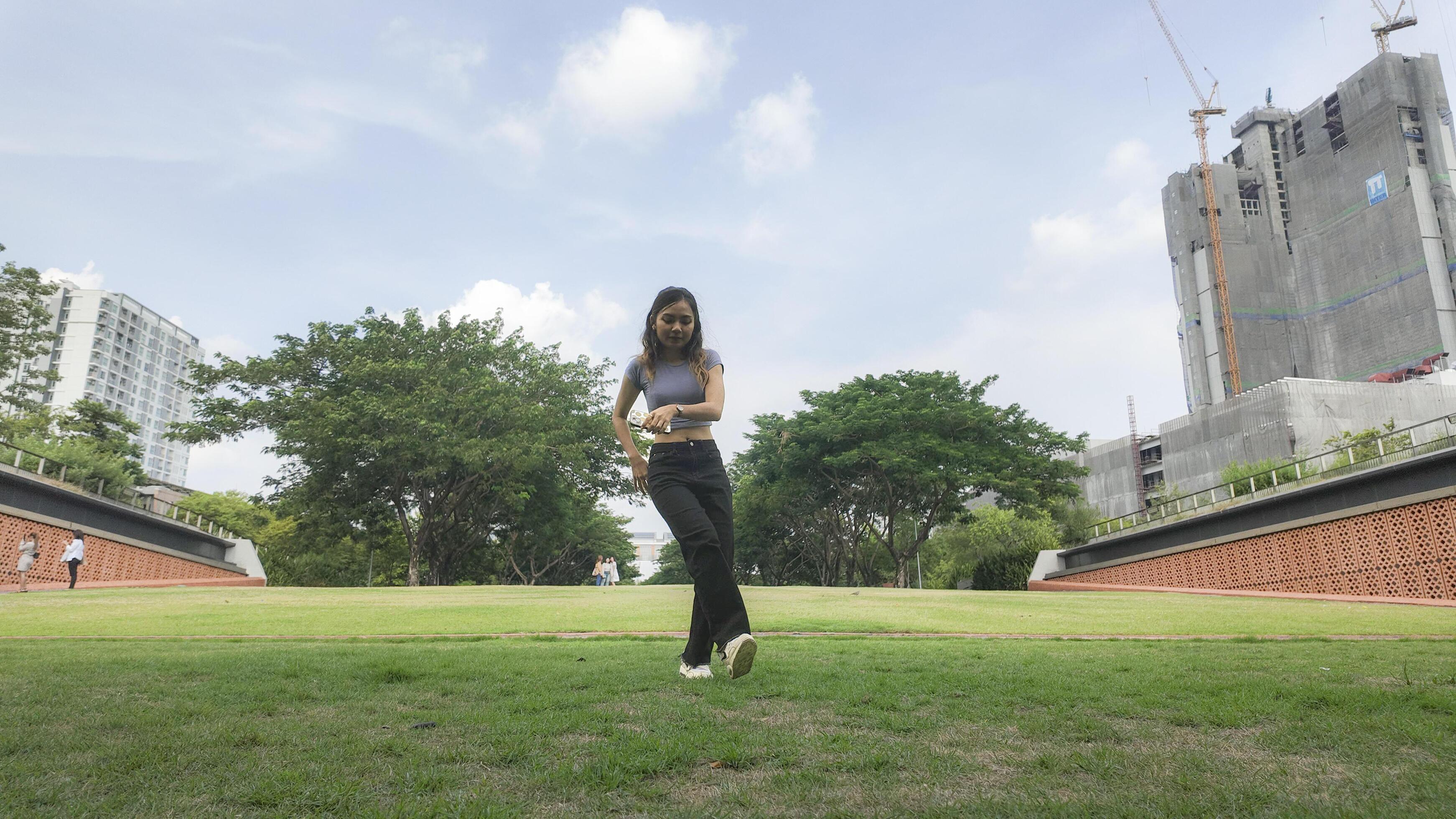 Asian women do freestyle hip hop and breakdancing in a public space in the middle of the city. With a cheerful and happy attitude Stock Free