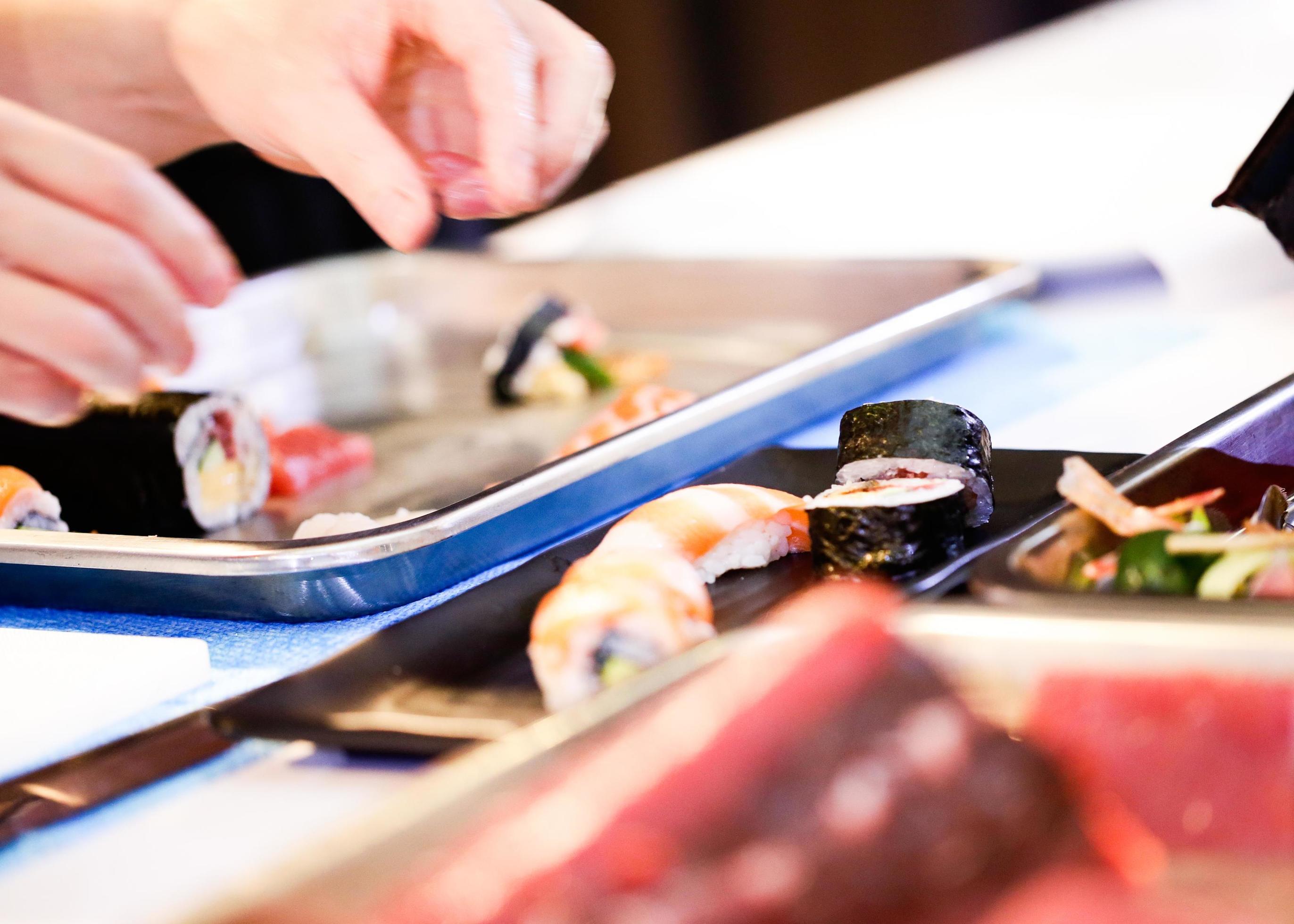 chef hands preparing japanese food, chef making sushi Stock Free