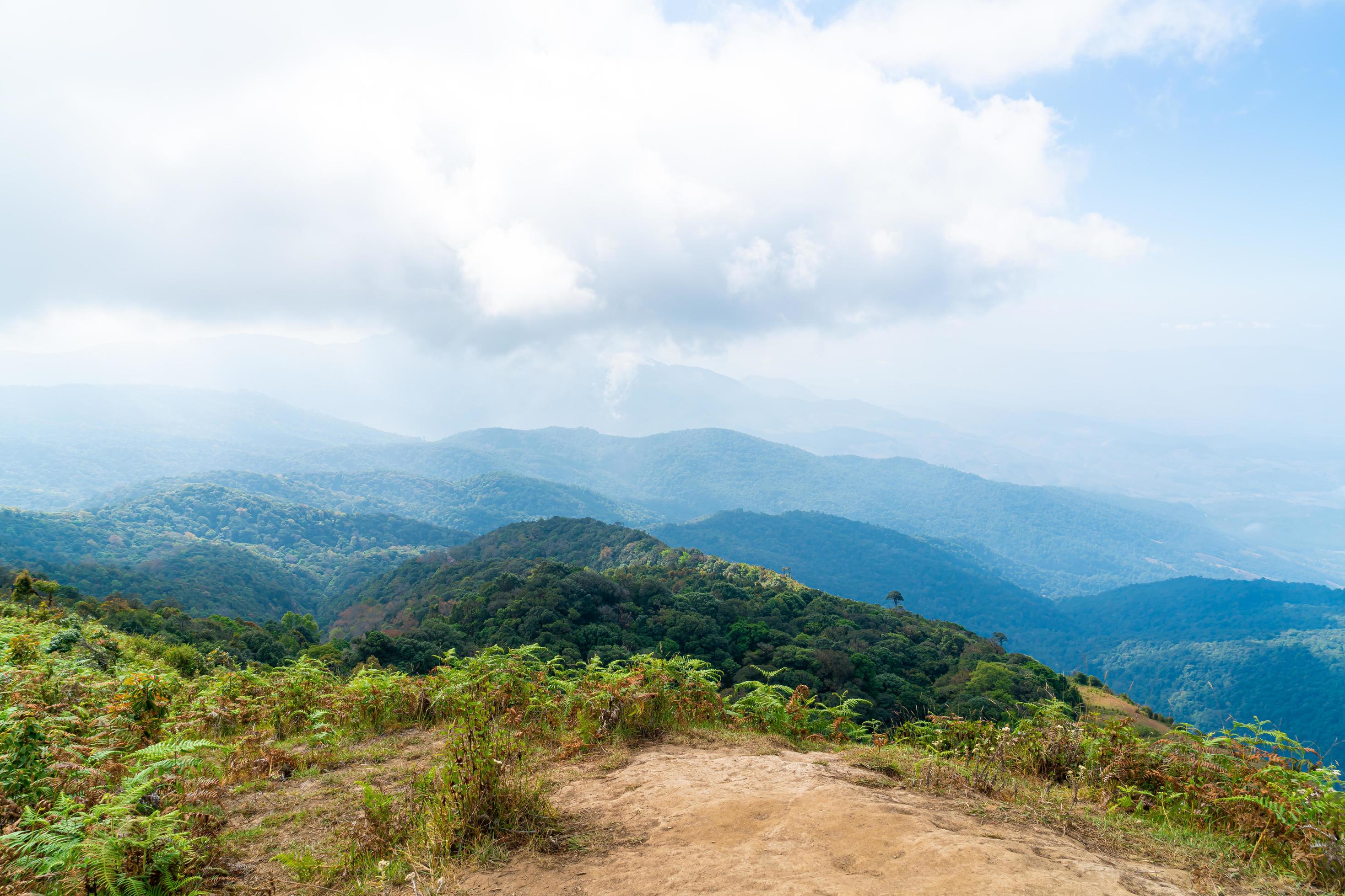 Beautiful mountain layer with clouds and blue sky at Kew Mae Pan Nature Trail in Chiang Mai, Thailand Stock Free