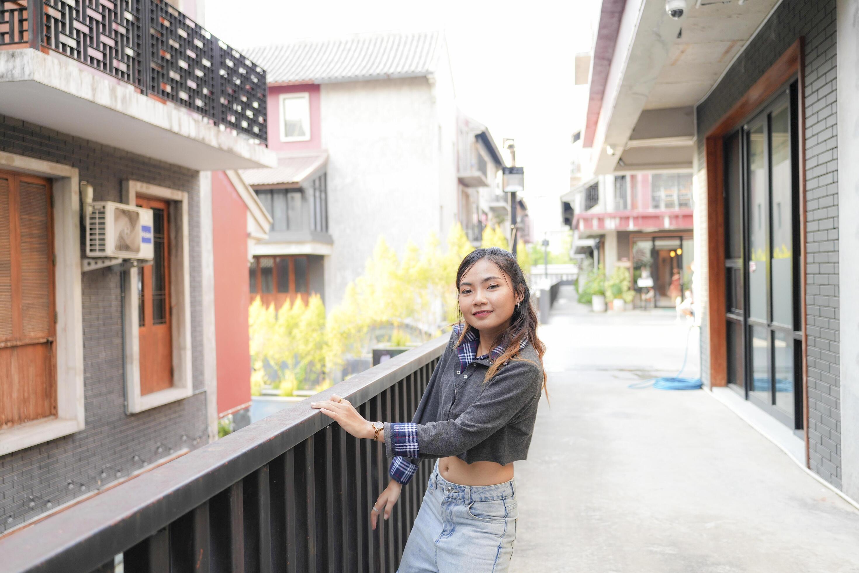 Asian women do freestyle hip hop and breakdancing in a public space in the middle of the city. With a cheerful and happy attitude Stock Free