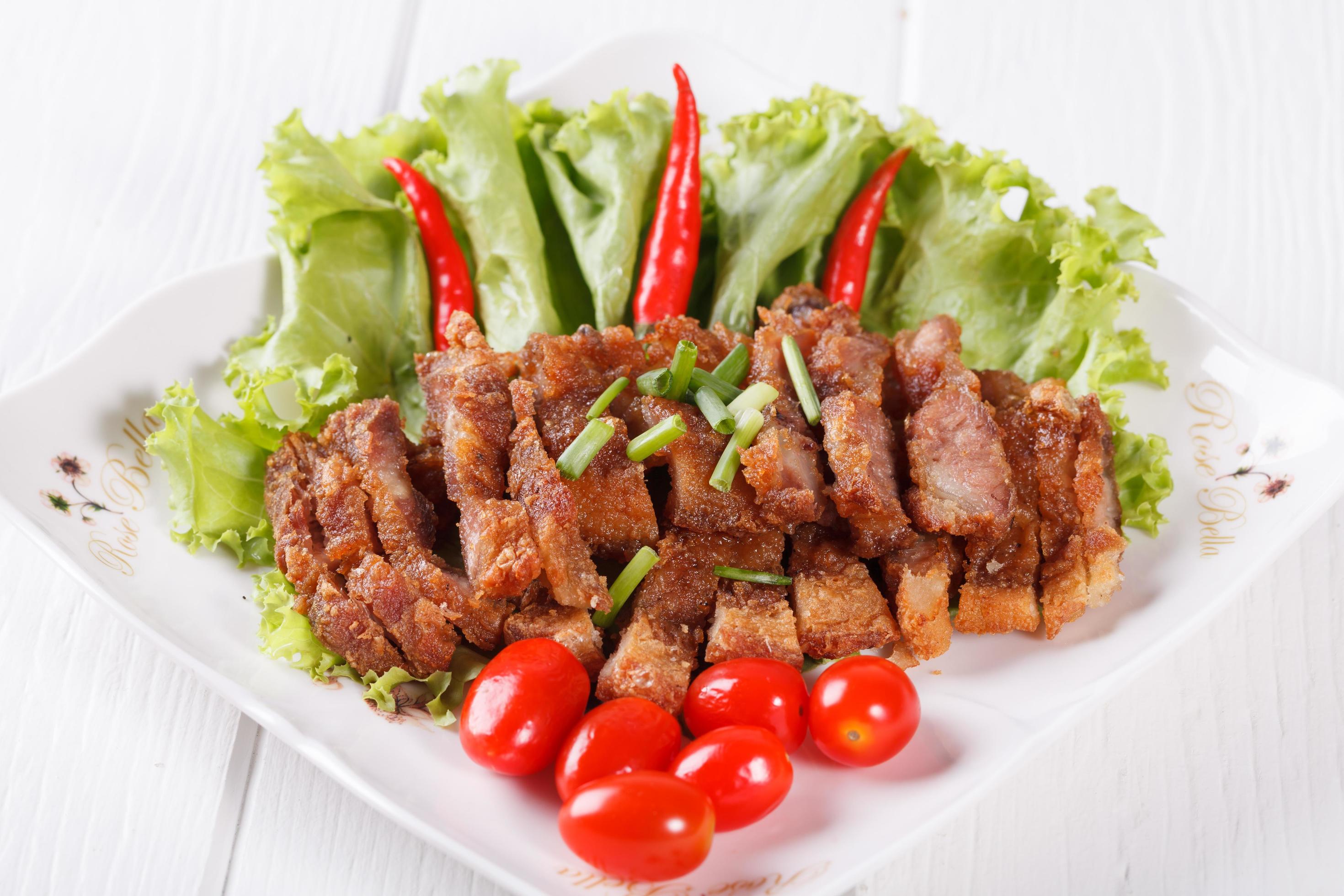 streaky pork fried with spicy dipping sauce, Thai food Stock Free