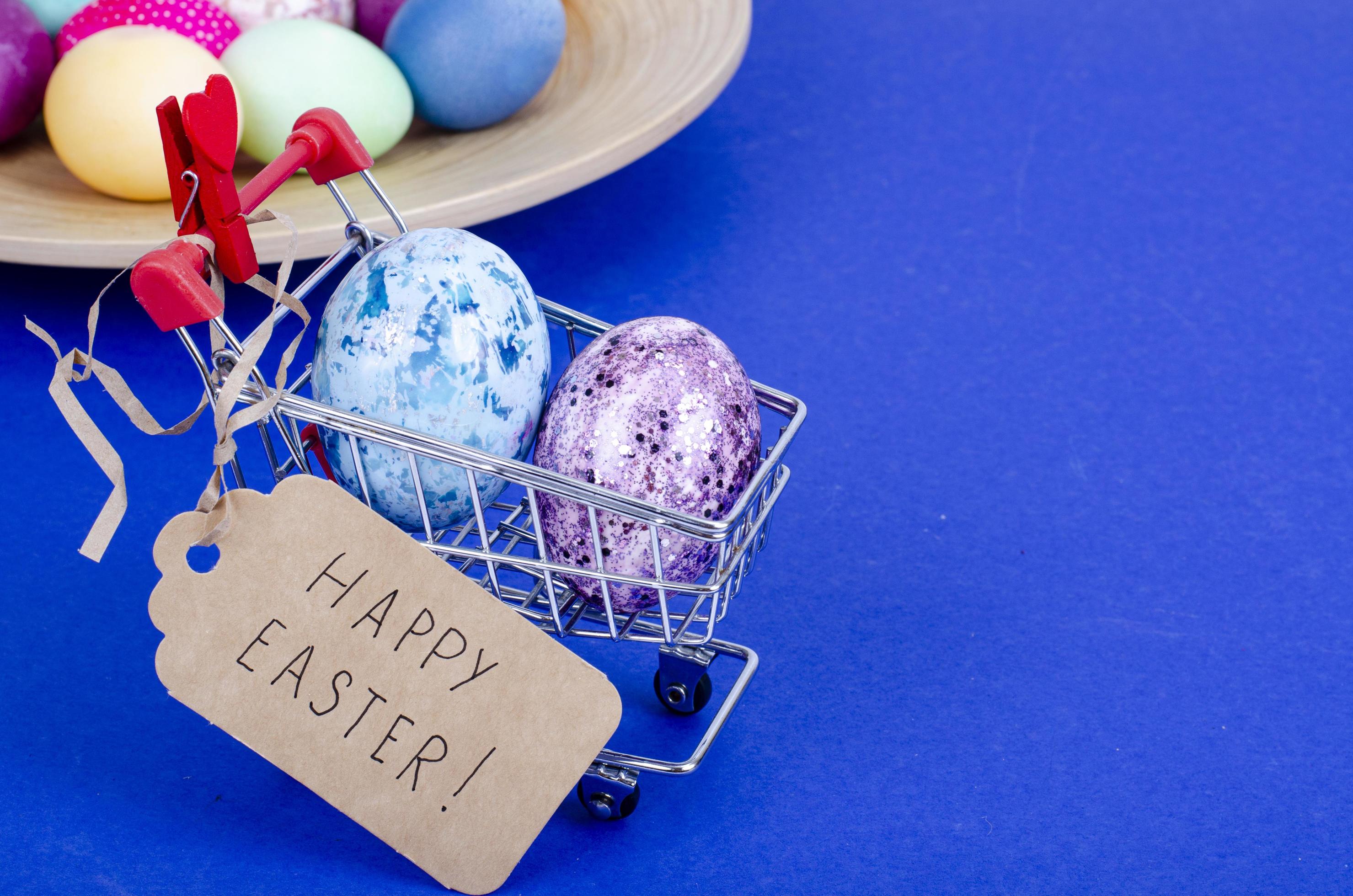 Grocery supermarket cart filled with chicken eggs. Concept of preparing for Easter, buying food. Space for text. Studio Photo Stock Free