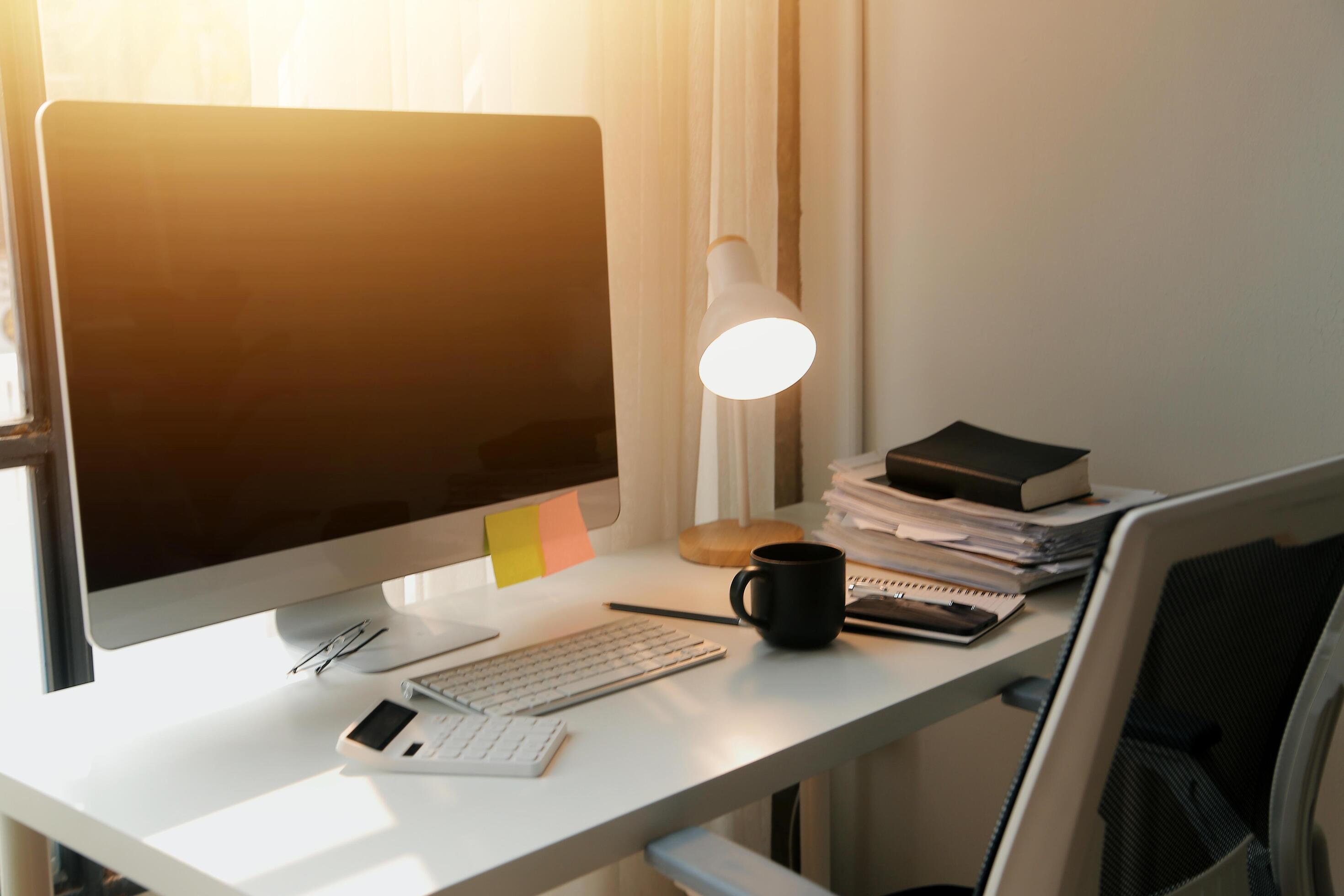 messy office workspace. Messy and cluttered office desk. Messy business office with piles of files and disorganized clutter. Stock Free