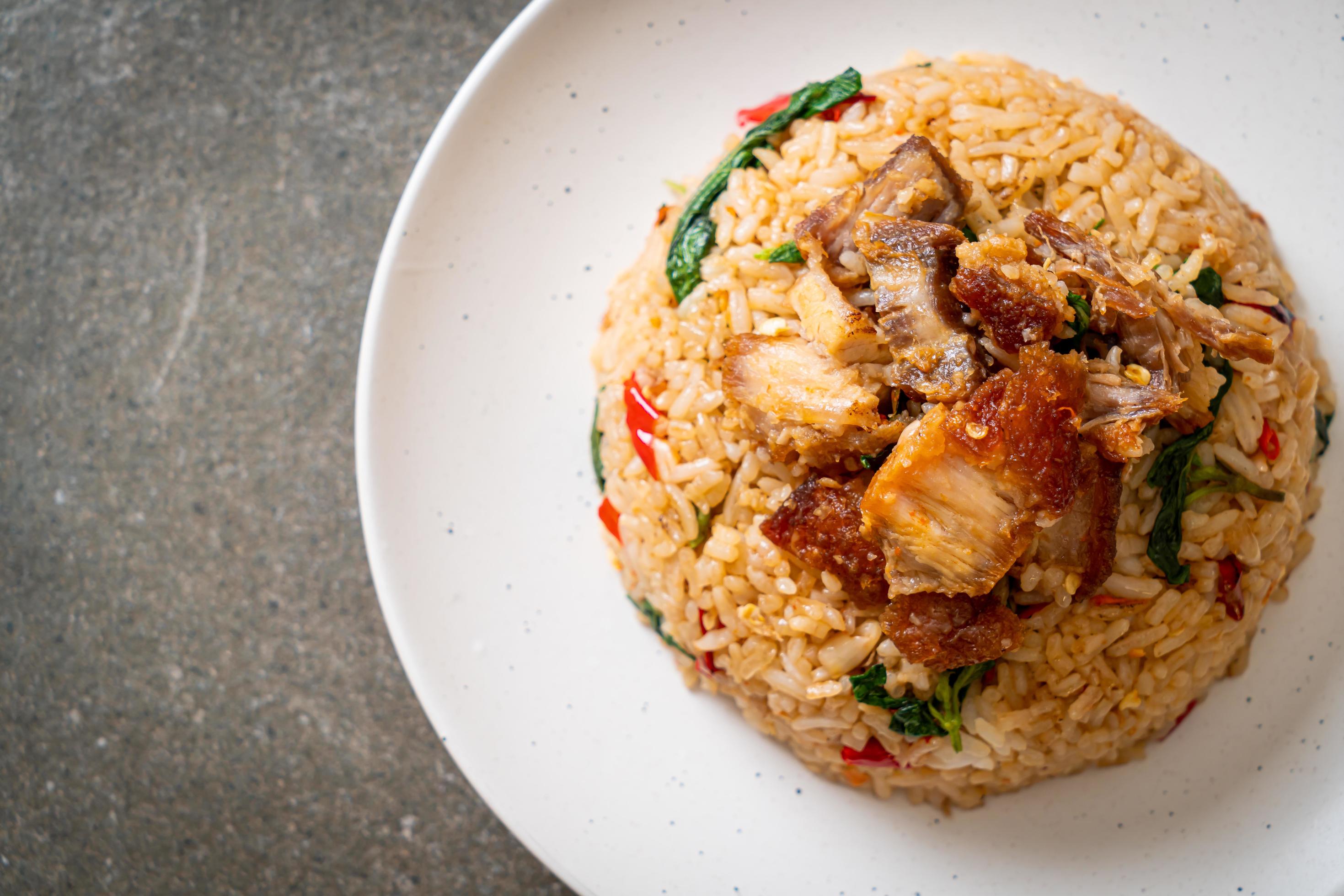 Fried rice with Thai basil and crispy belly pork – Thai food style Stock Free