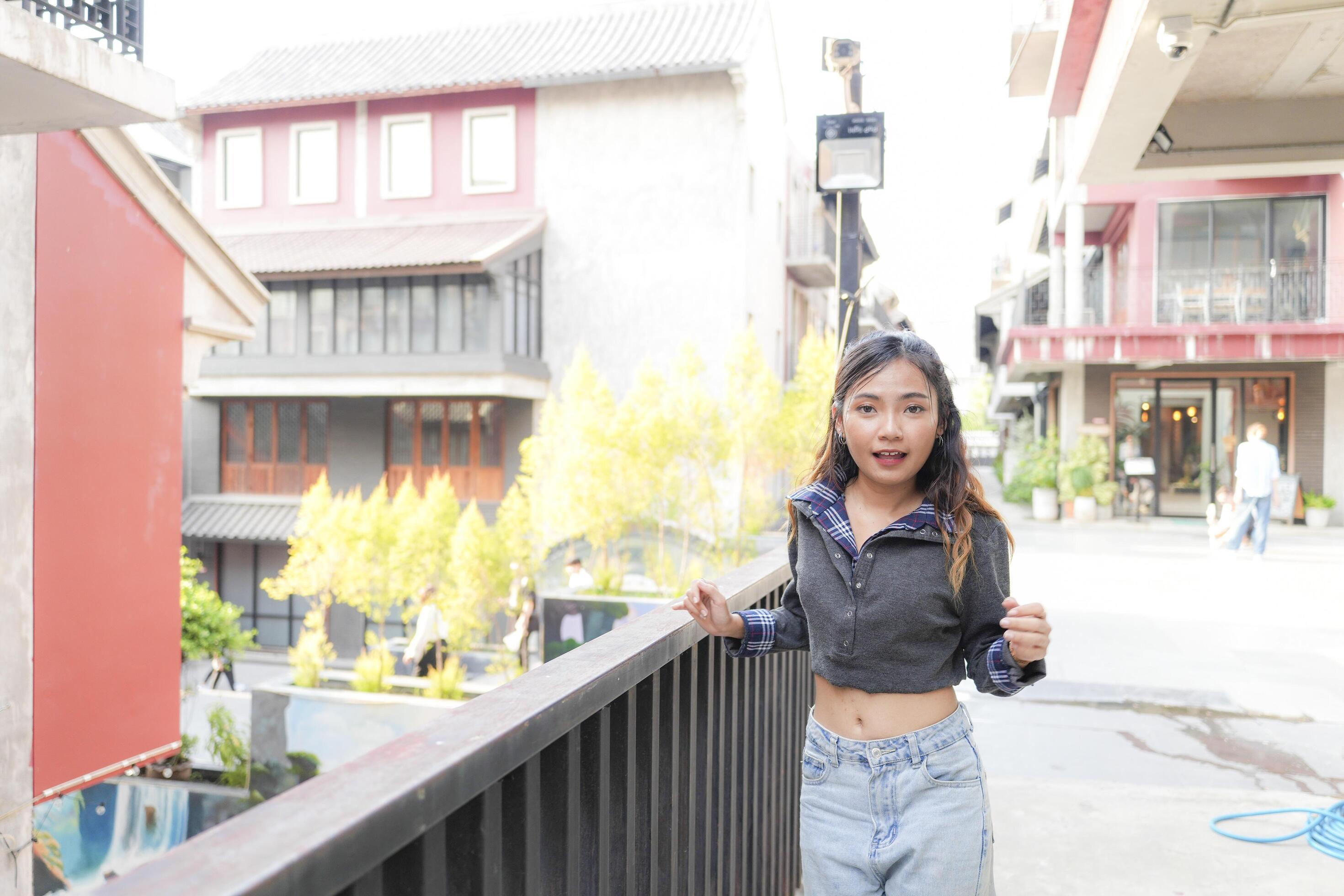 Asian women do freestyle hip hop and breakdancing in a public space in the middle of the city. With a cheerful and happy attitude Stock Free