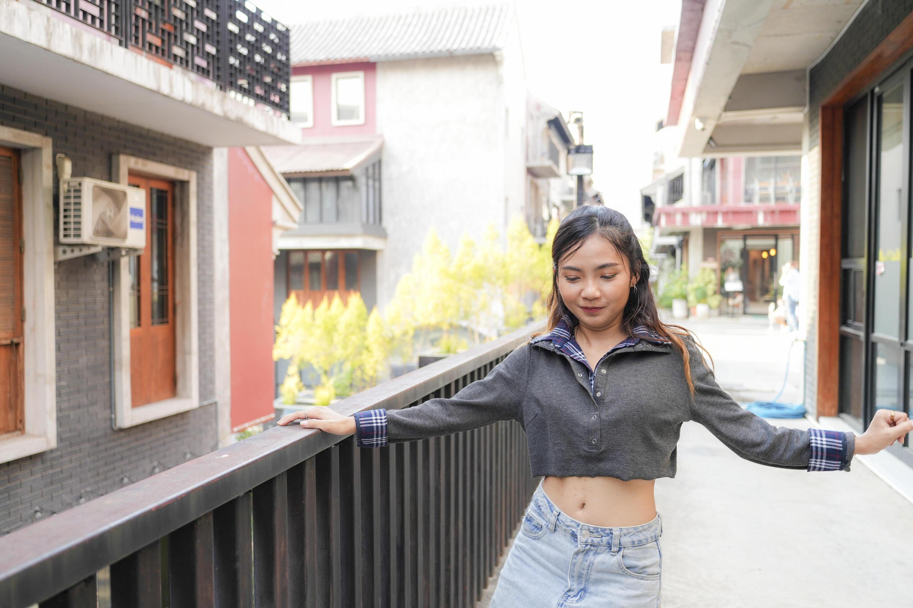 Asian women do freestyle hip hop and breakdancing in a public space in the middle of the city. With a cheerful and happy attitude Stock Free