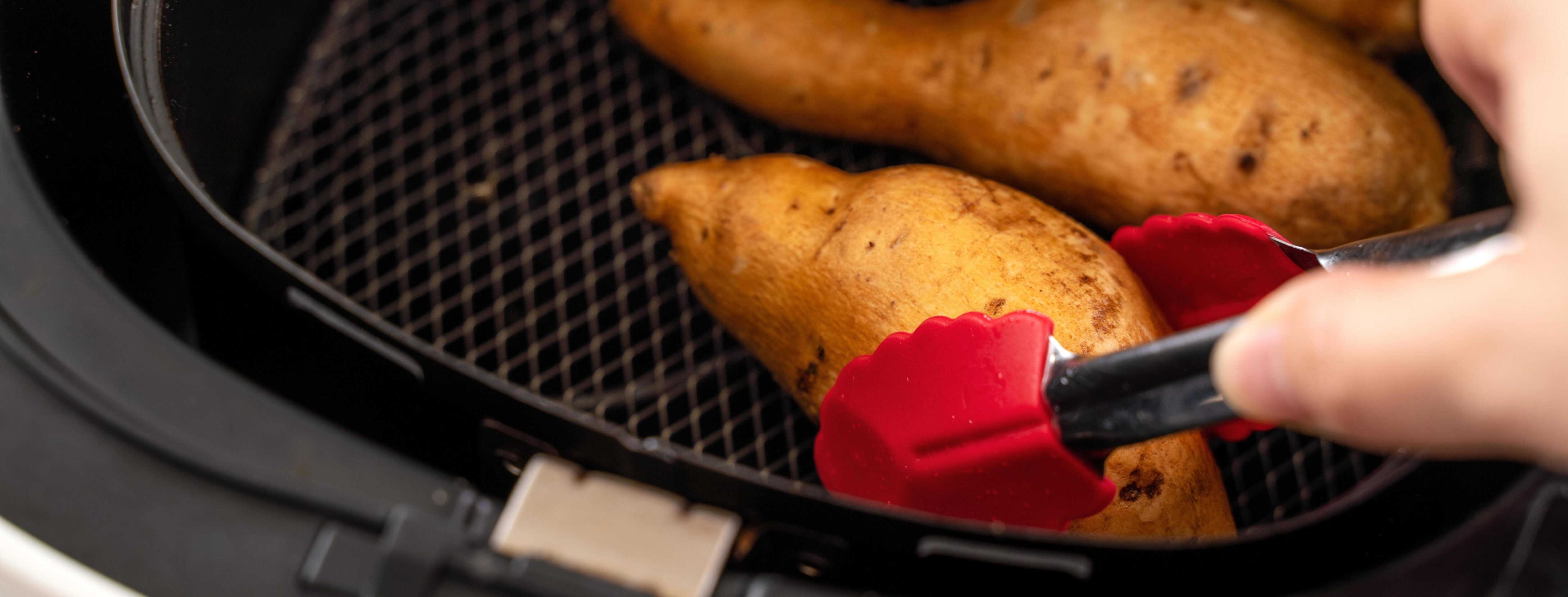 Roasted sweet potato cooked by airfryer at home. Healthy food for diet eating. Stock Free