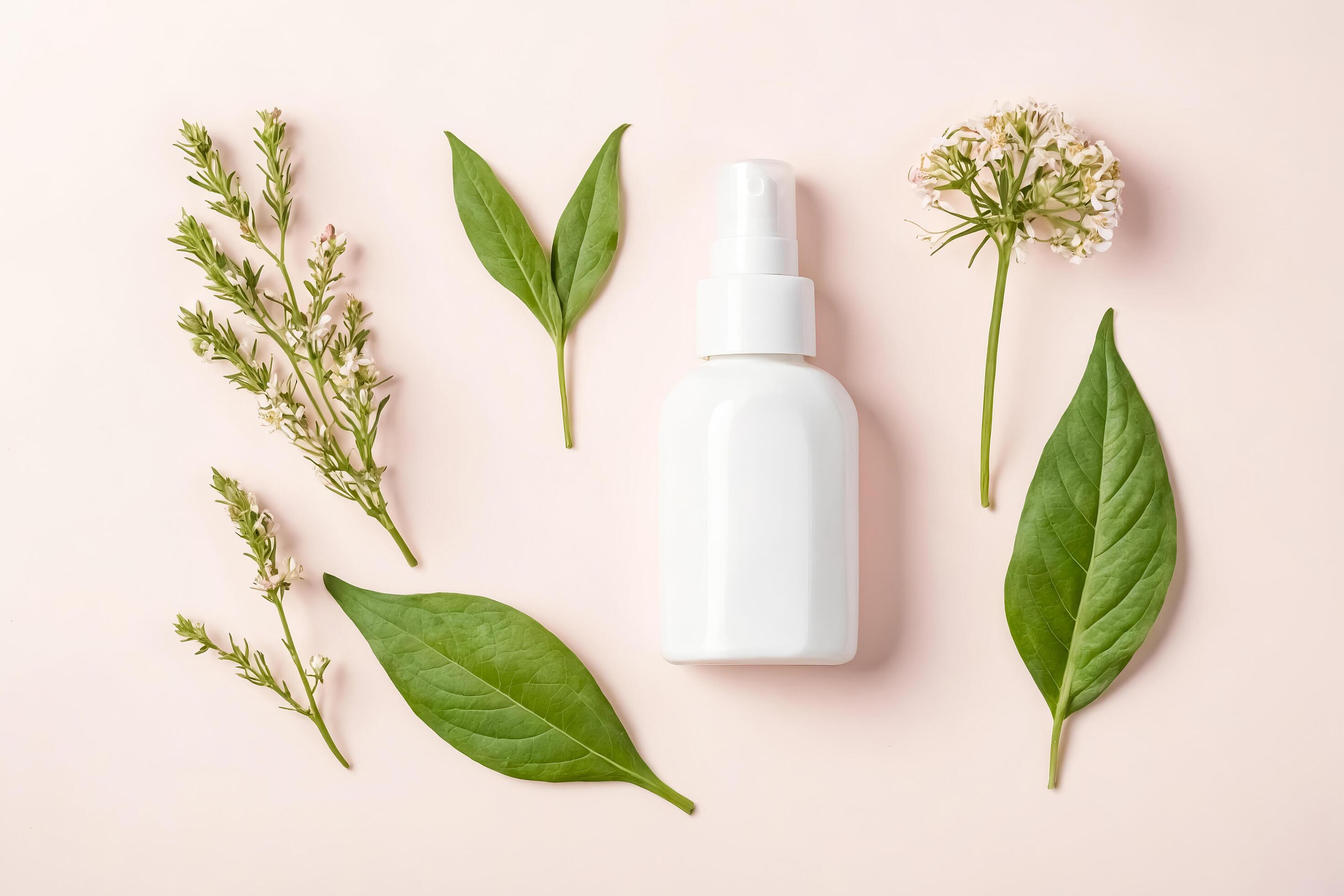 White Bottle with Green Leaves and White Flowers on Pink Background Stock Free