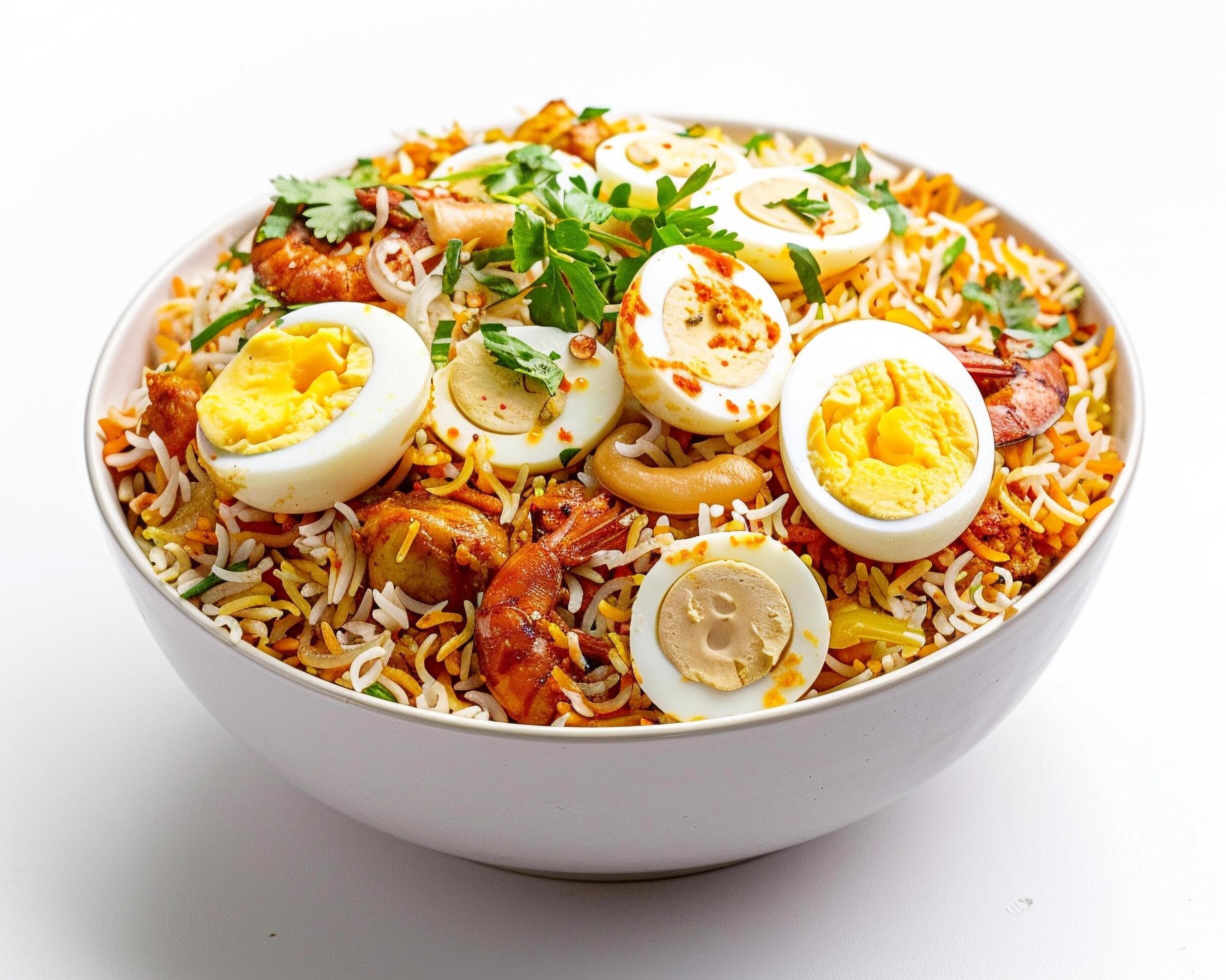 a bowl of rice with eggs and vegetables Stock Free