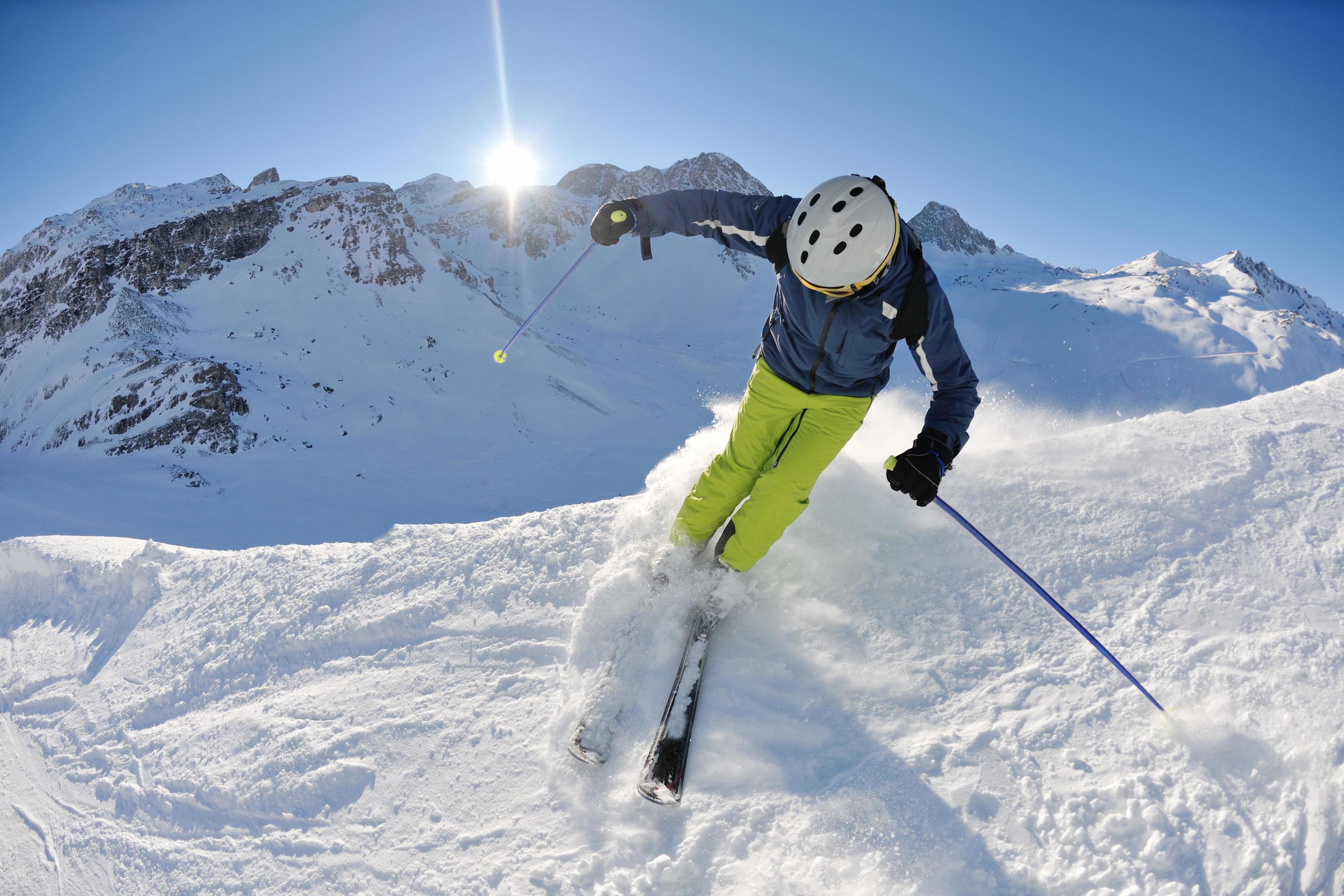 skiing on fresh snow at winter season at beautiful sunny day Stock Free