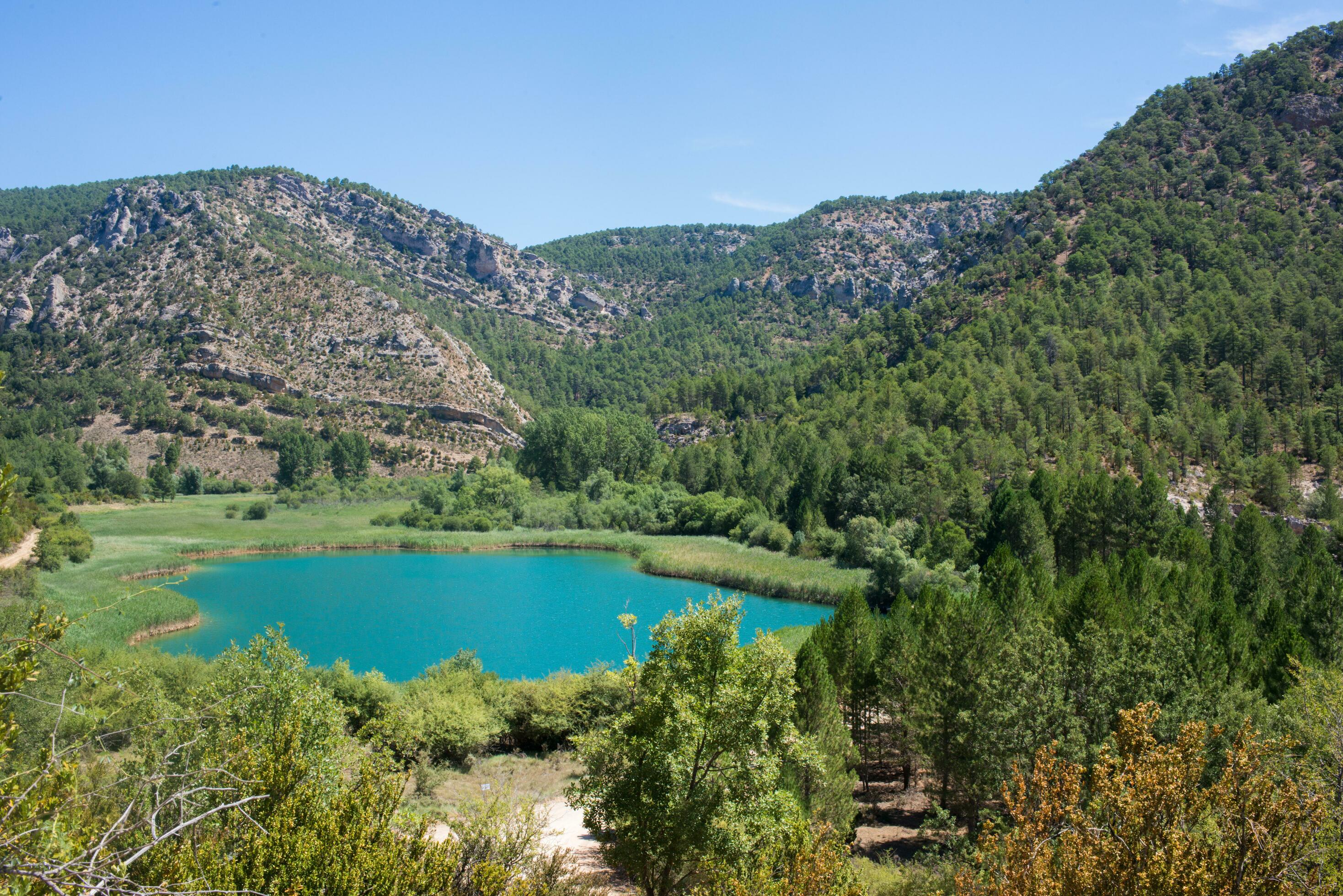 Beautiful landscape with mountains forest, and turquoise lake. Guadalajara, Spain Stock Free