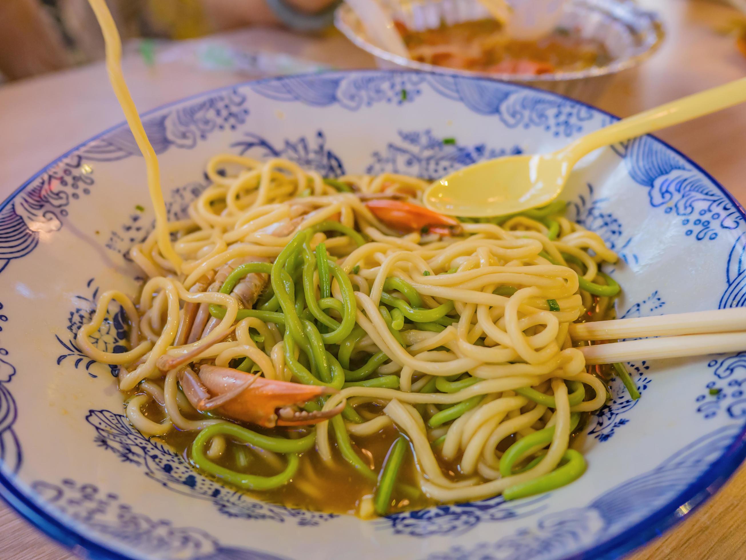 Close up Crab Noodle Street Food on Taiping old Street in the evening time at Changsha city hunan China Stock Free