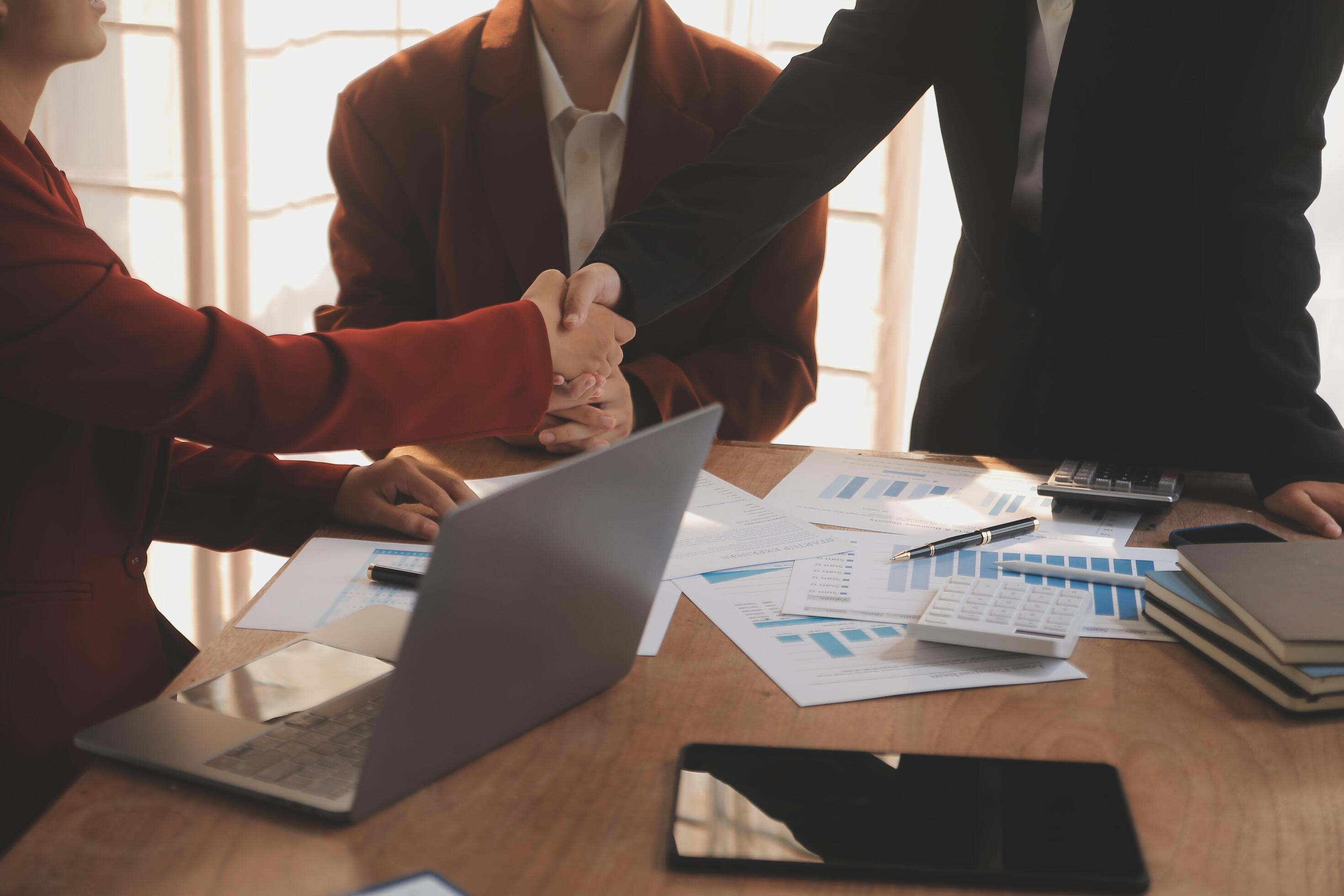 Close up of a team of business people having a meeting to analyze data for a marketing plan. Stock Free