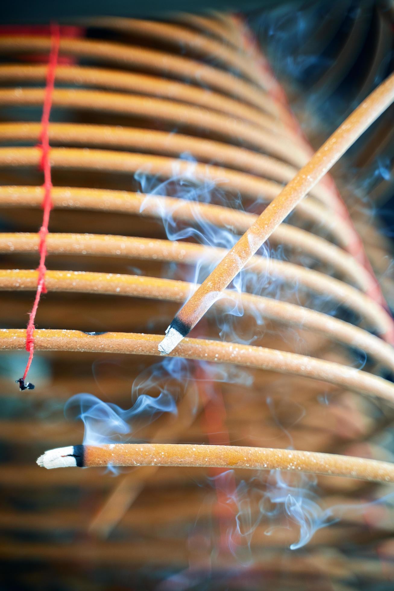 Burned coil swirl incense in Macau Macao temple, traditional Chinese cultural customs to worship god, close up, lifestyle. Stock Free