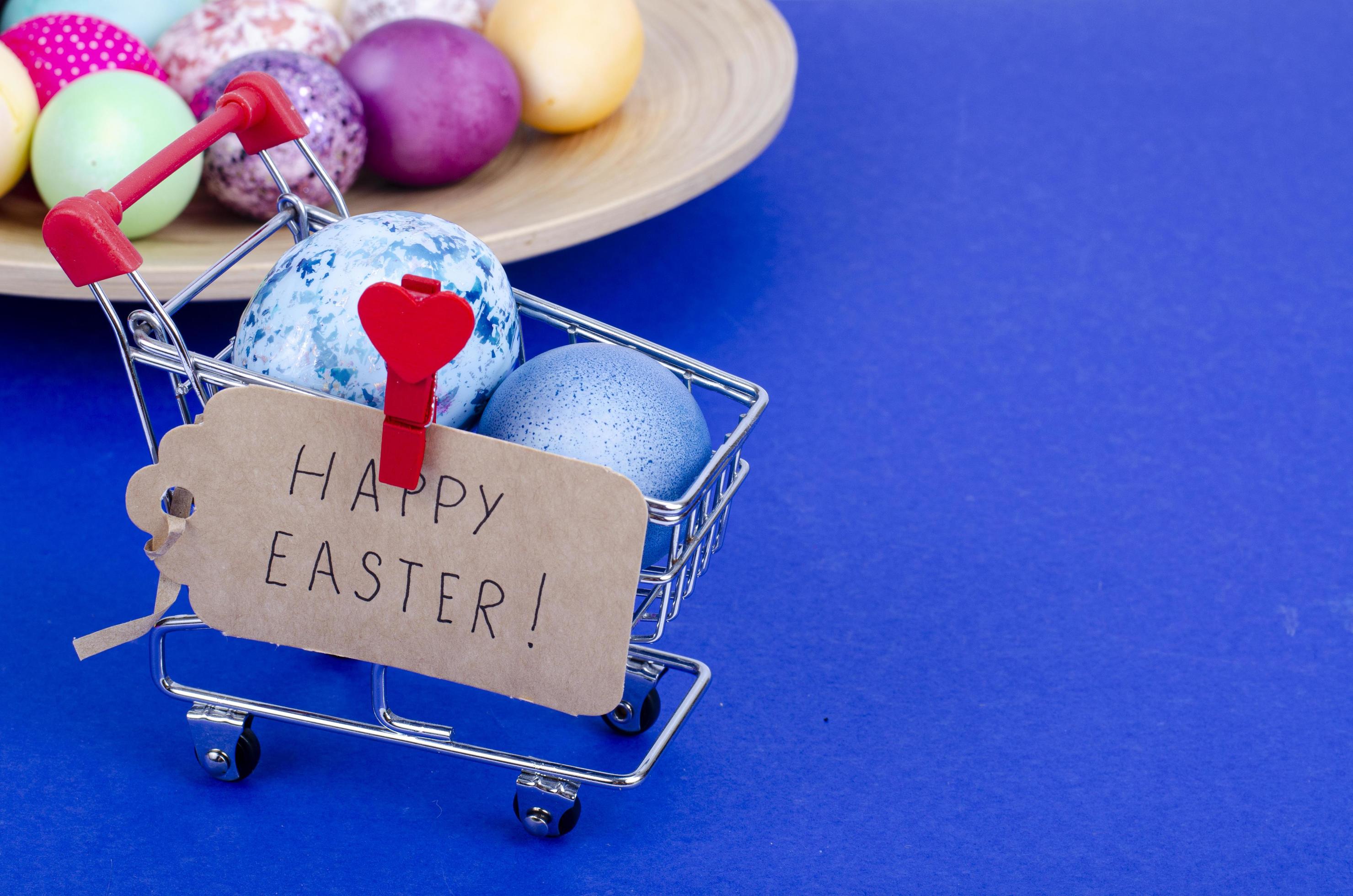 Grocery supermarket cart filled with chicken eggs. Concept of preparing for Easter, buying food. Space for text. Studio Photo Stock Free