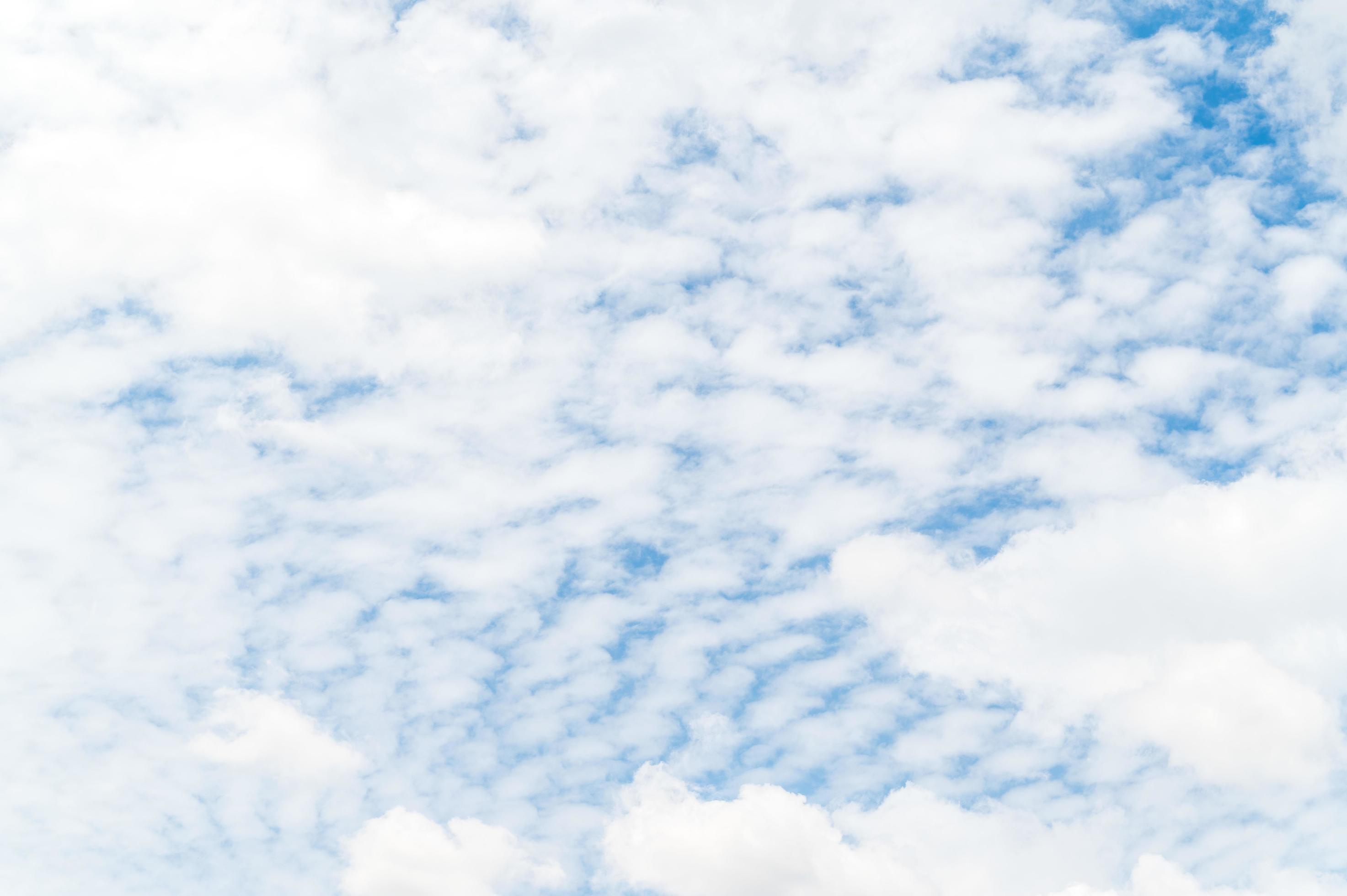 Beautiful white fluffy clouds in blue sky. Nature background from white clouds in sunny day Stock Free